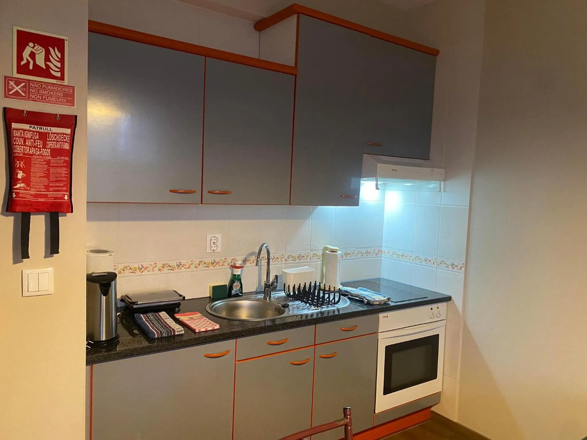Kitchen or kitchenette in Apartamentos São João