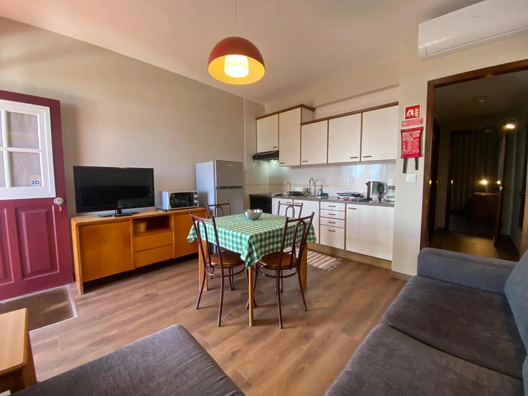 Kitchen or kitchenette in Apartamentos São João