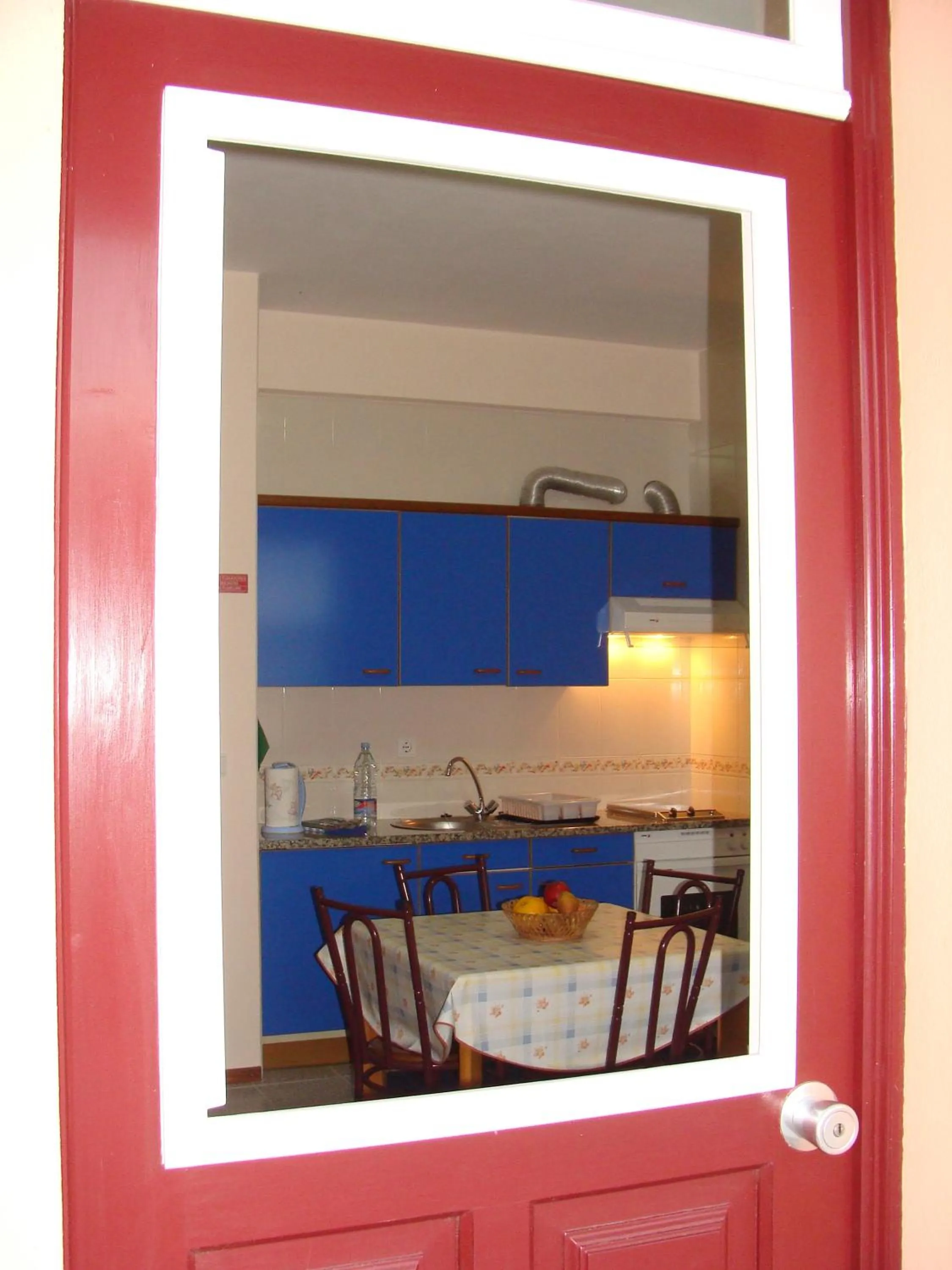 Kitchen or kitchenette in Apartamentos São João