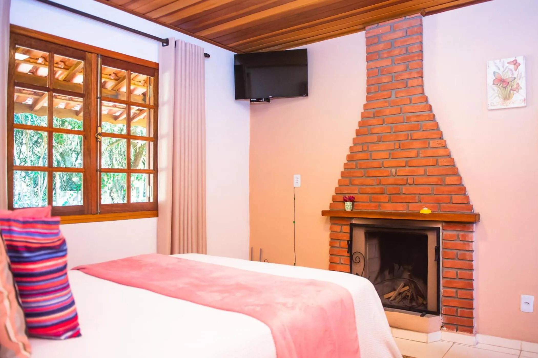 Bed in Chalés Recanto da cachoeira