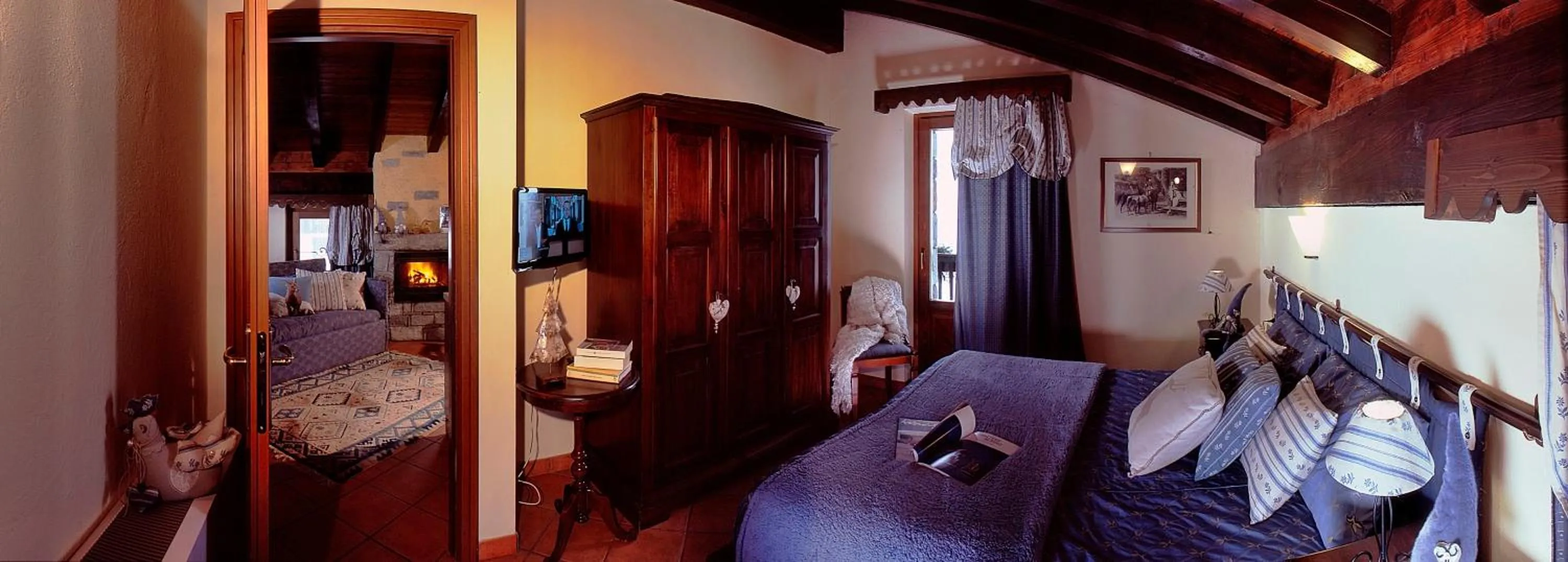 Photo of the whole room, Bed in Aparthotel Foyer d'antan SUITE con caminetto hammam o vasca idromassaggio