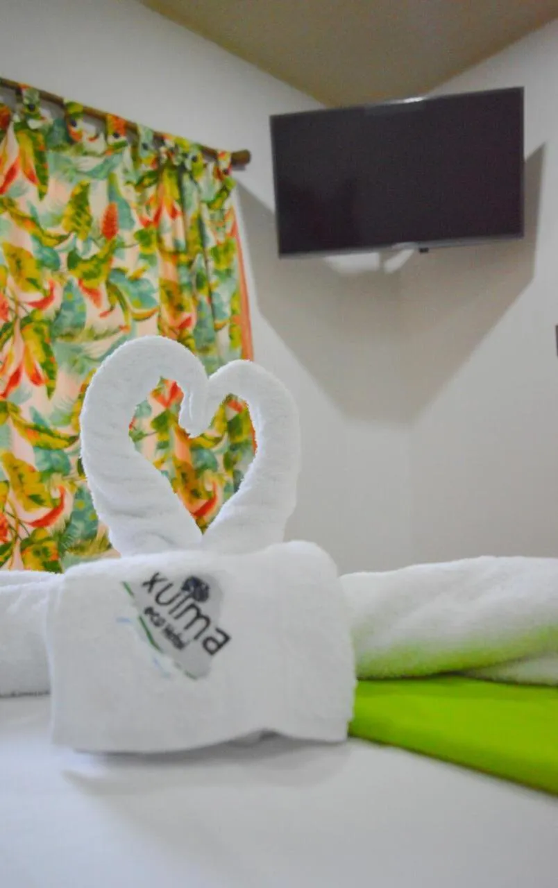 TV and multimedia, Bed in Eco Hostal Kuima