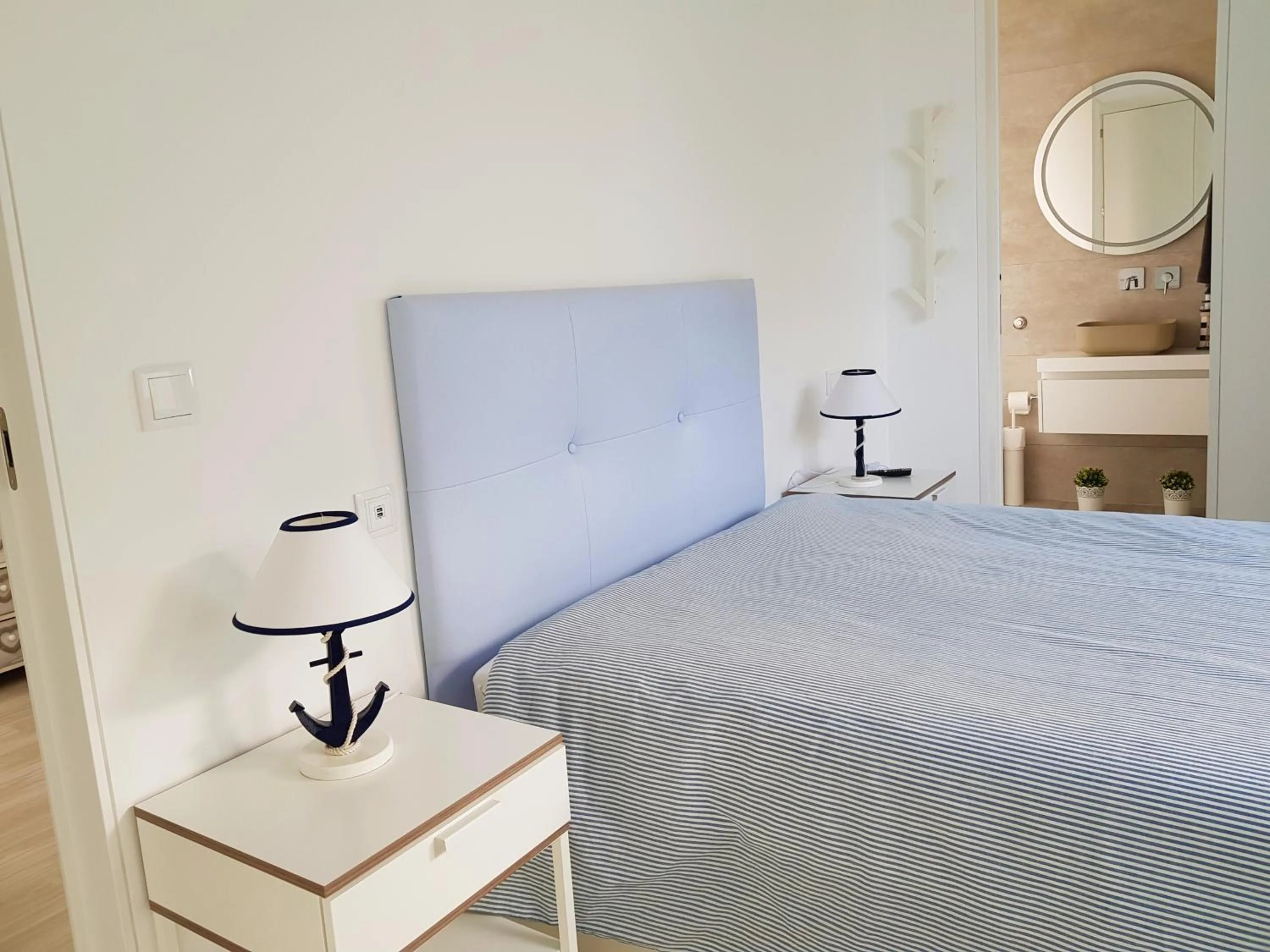 Bed in Blue Sea Apartment