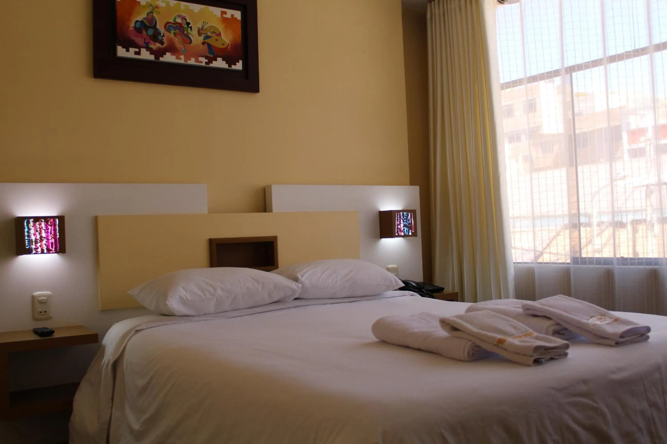 Bed in Kaaro Hotel Puno