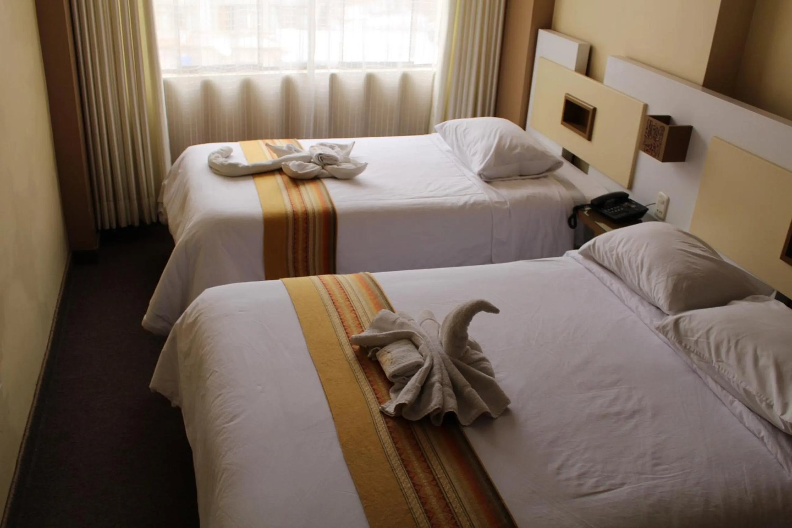 Bed in Kaaro Hotel Puno