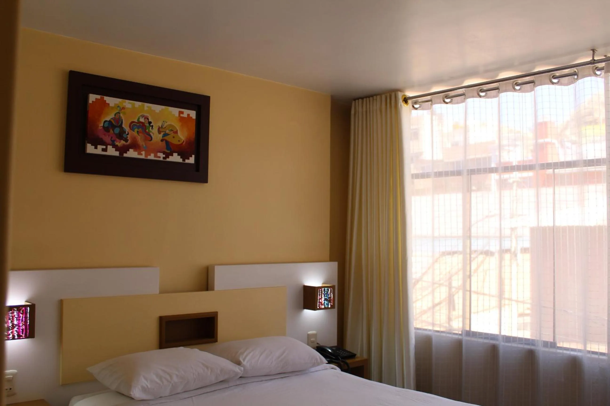 Bed in Kaaro Hotel Puno