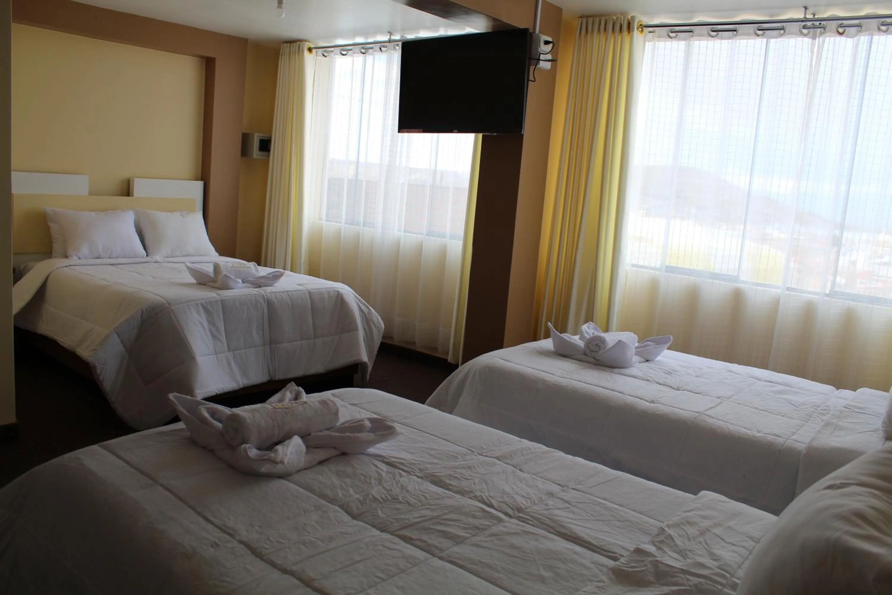Bed in Kaaro Hotel Puno