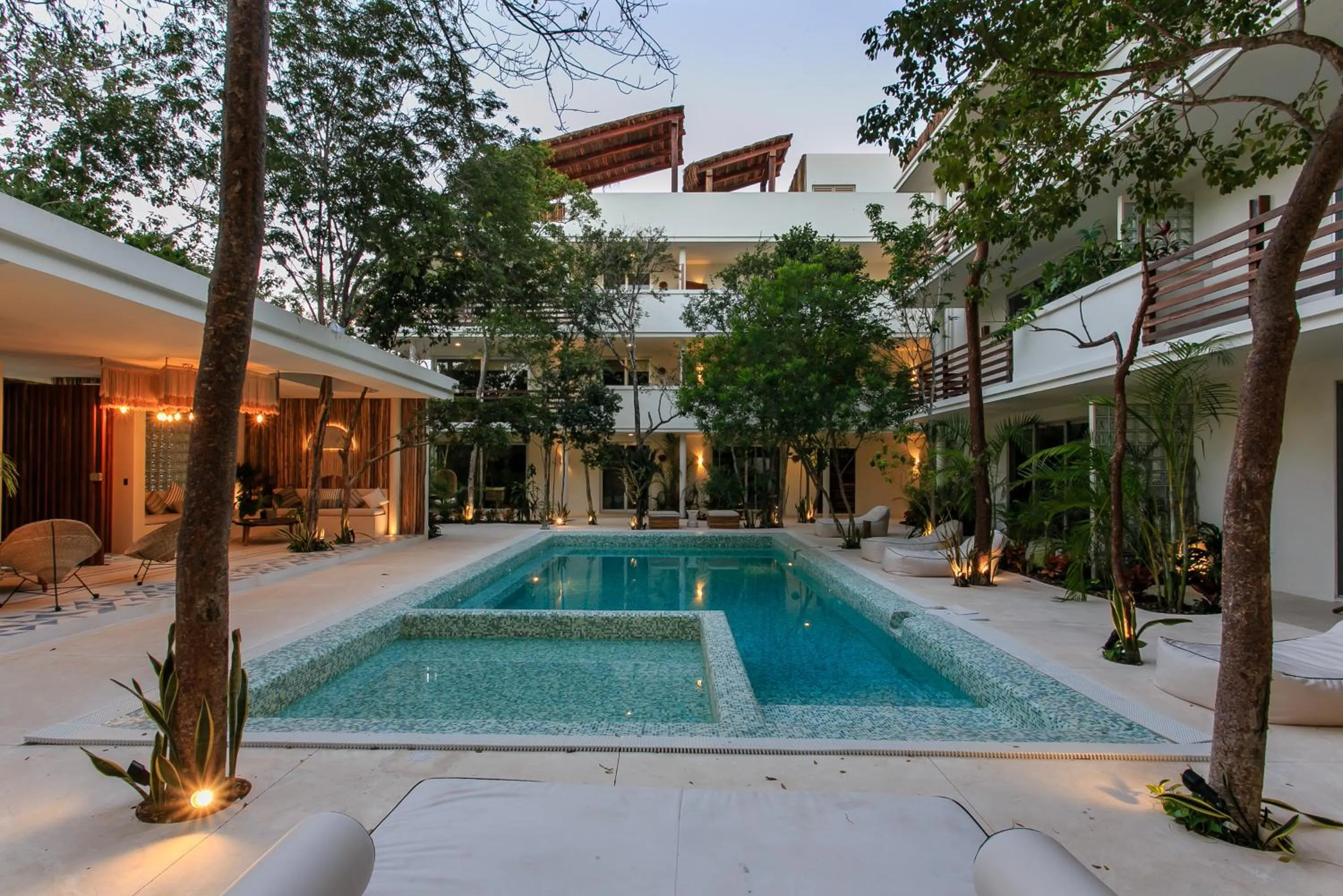 Swimming pool in Charming Nature-Inspired Condos with Sultry Surroundings by Stella Rentals