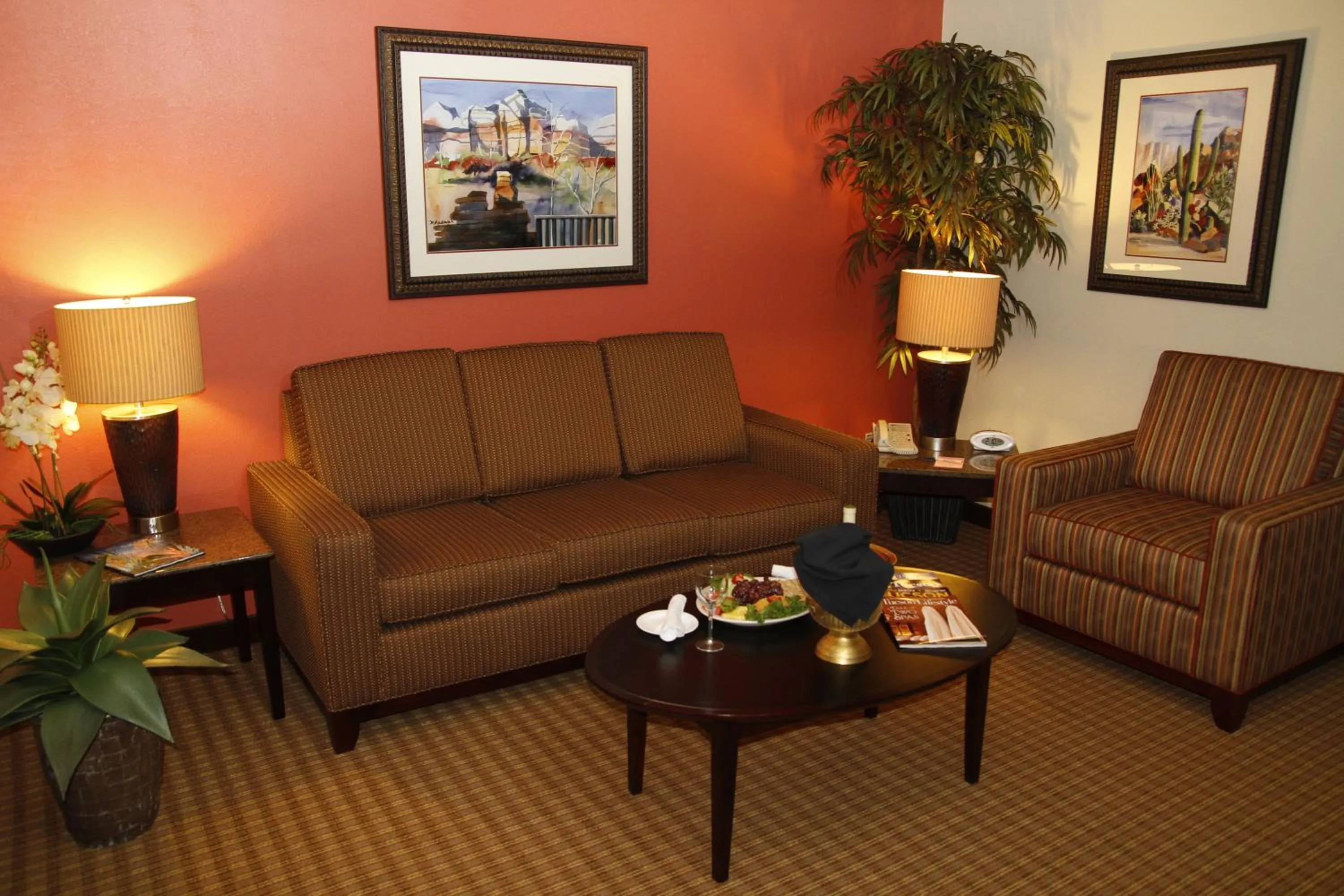 Seating area in Ramada by Wyndham Viscount Suites Tucson East