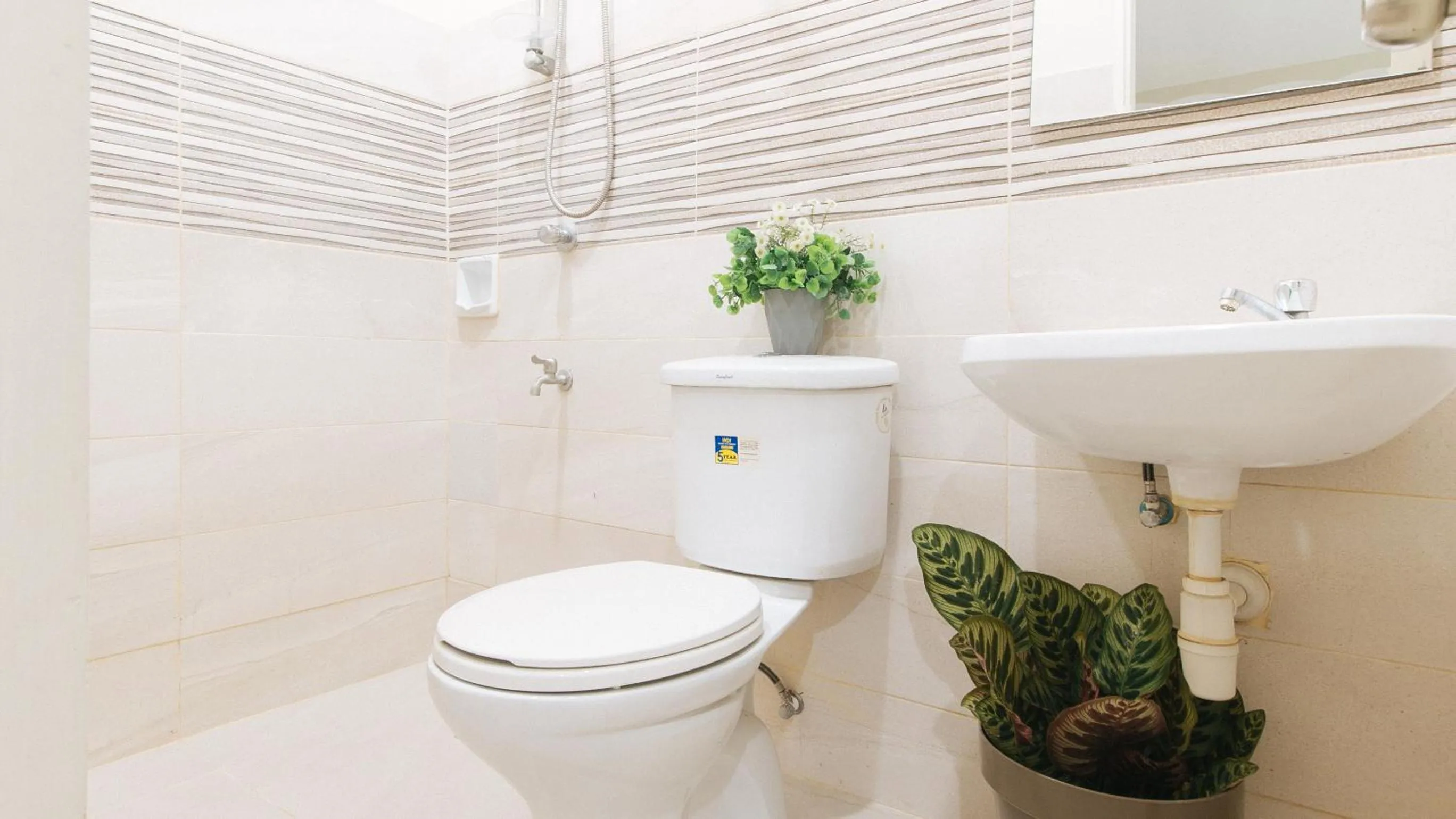 Toilet in UrbanView at Lacson Street Bacolod City by RedDoorz