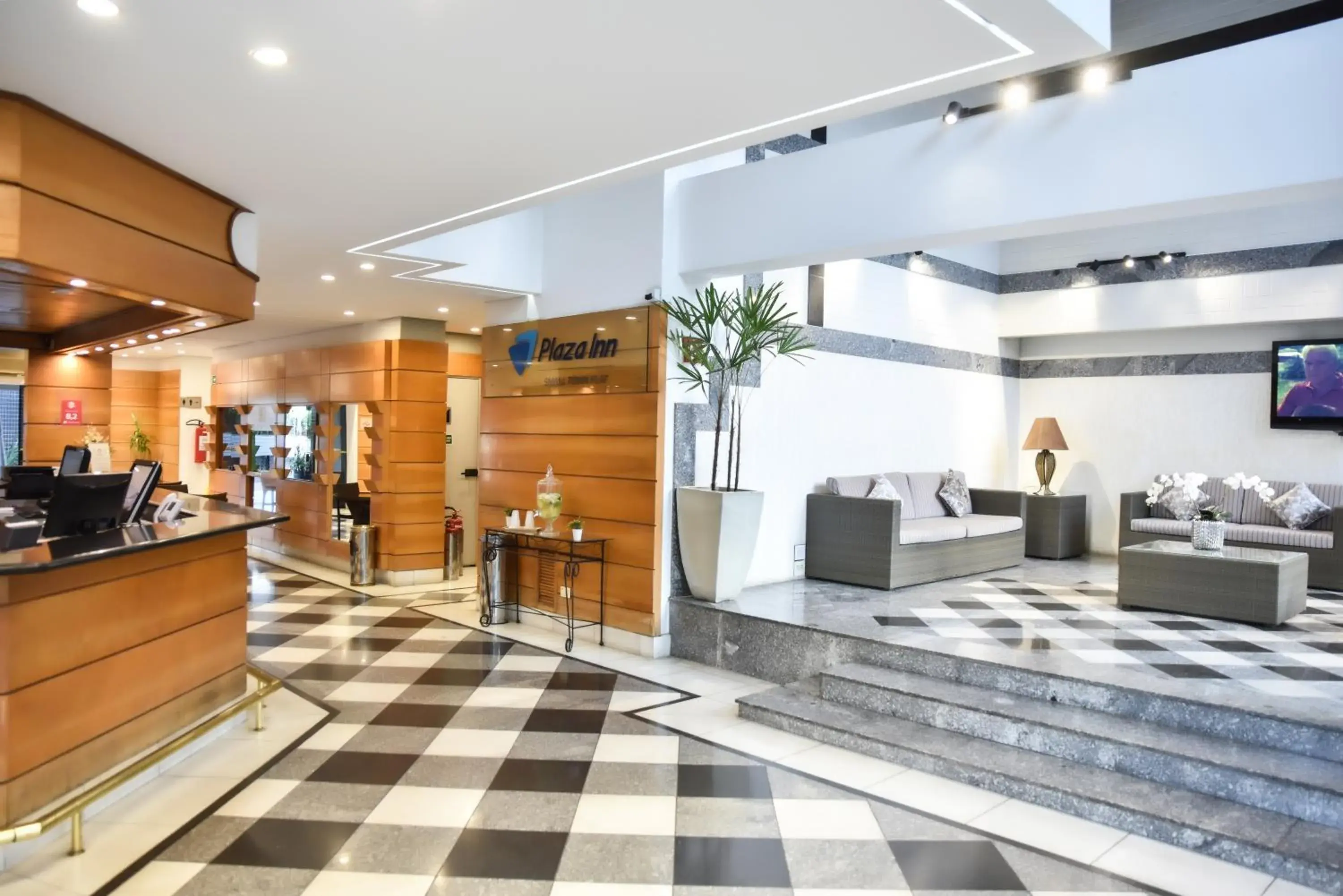 Lobby or reception in Plaza Inn Small Town Flat Lobby or reception in Plaza Inn Small Town Flat