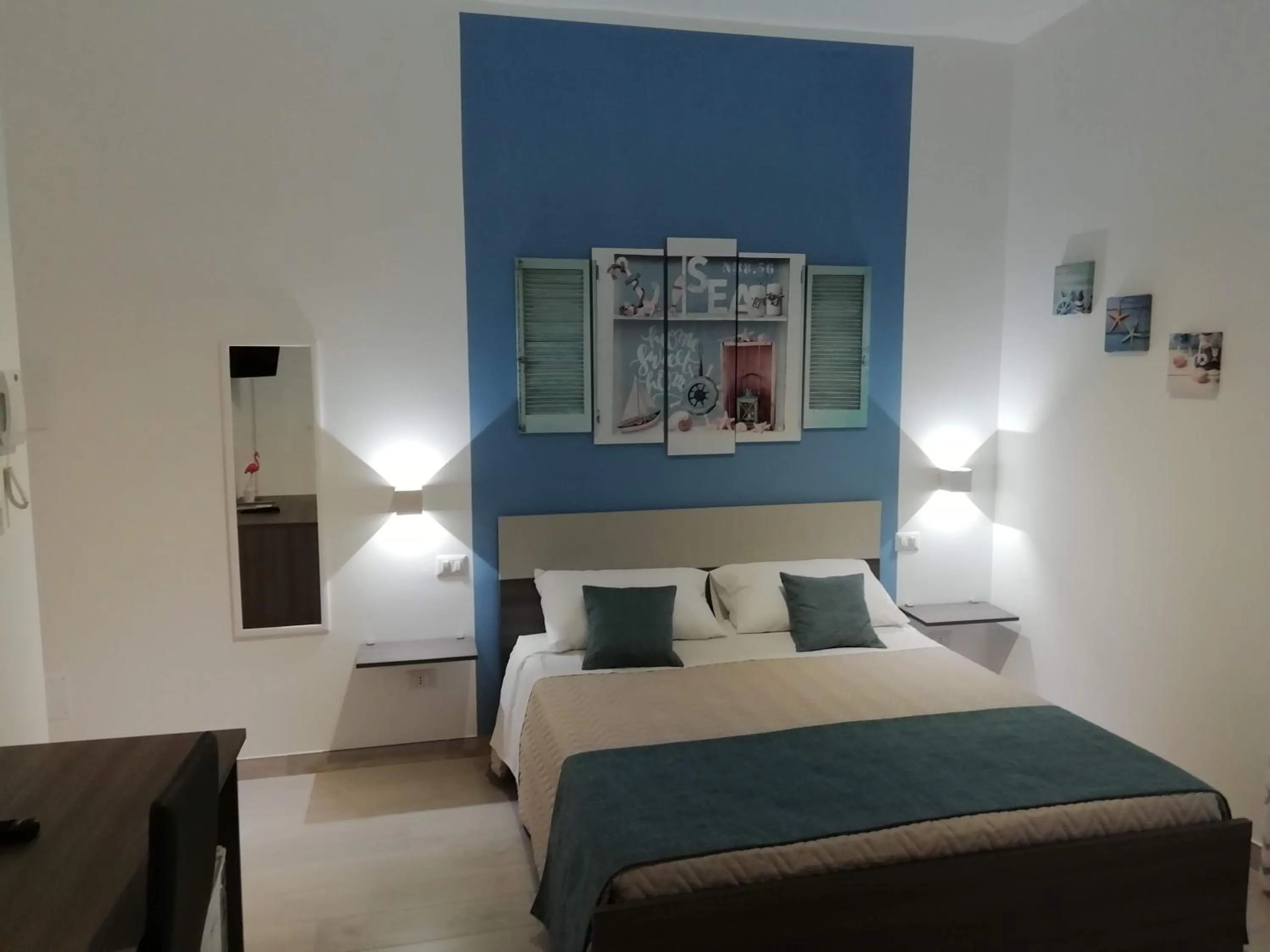 Bed in Flamingo Rooms