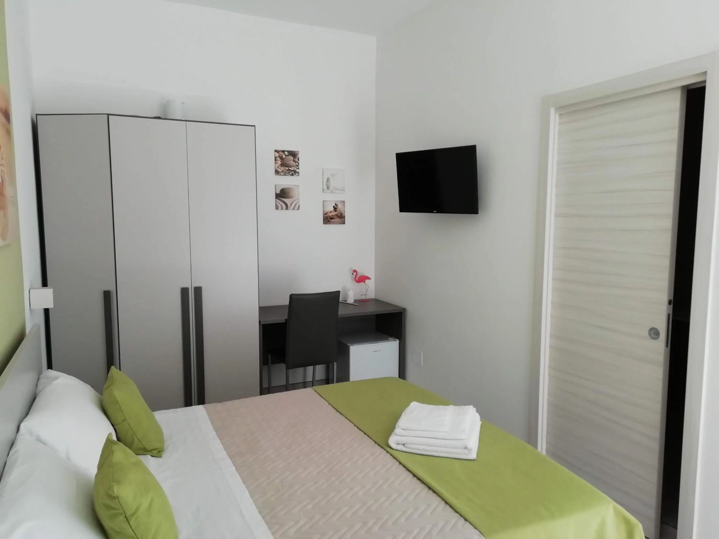 Bed in Flamingo Rooms