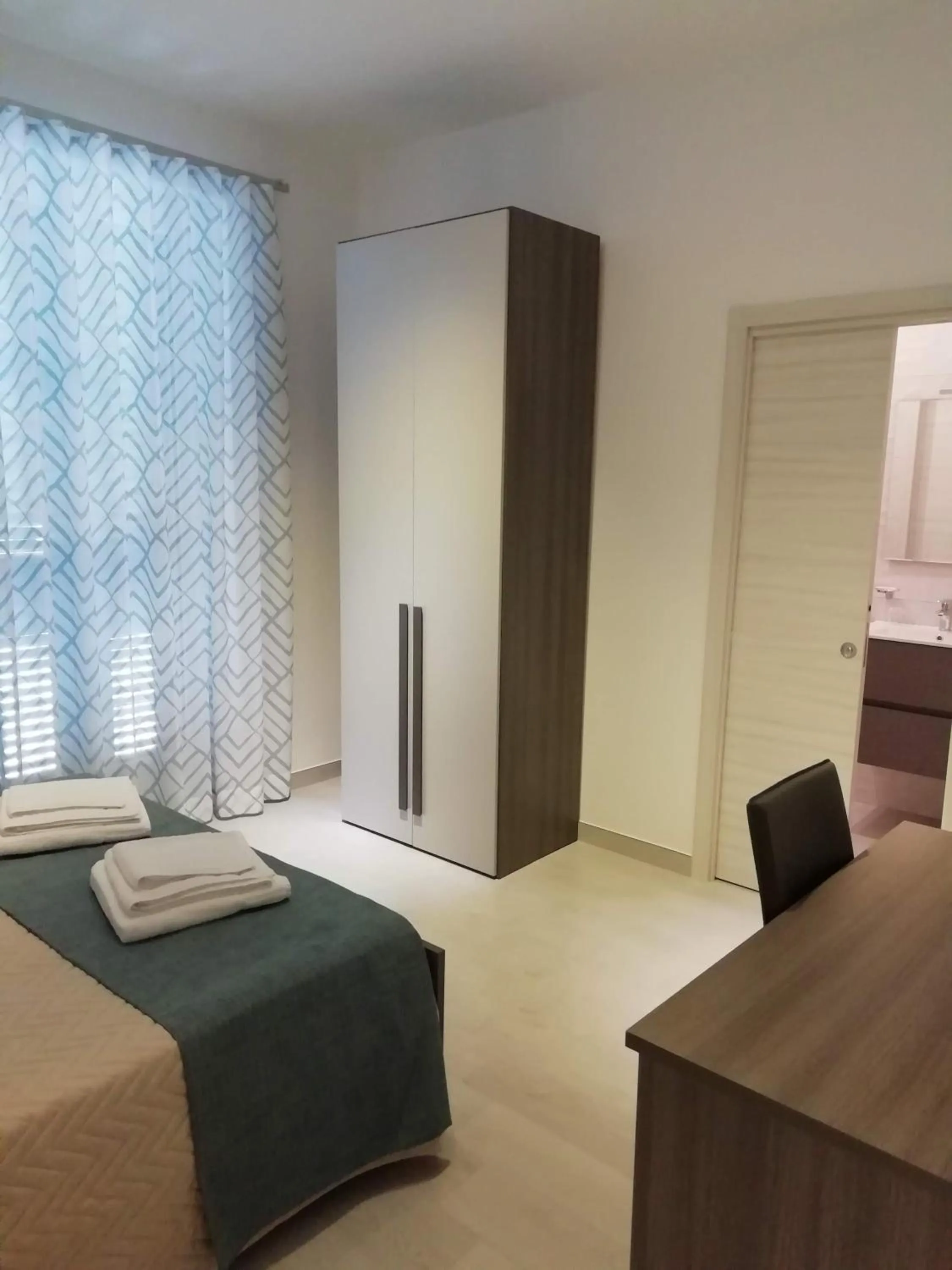 Bed in Flamingo Rooms