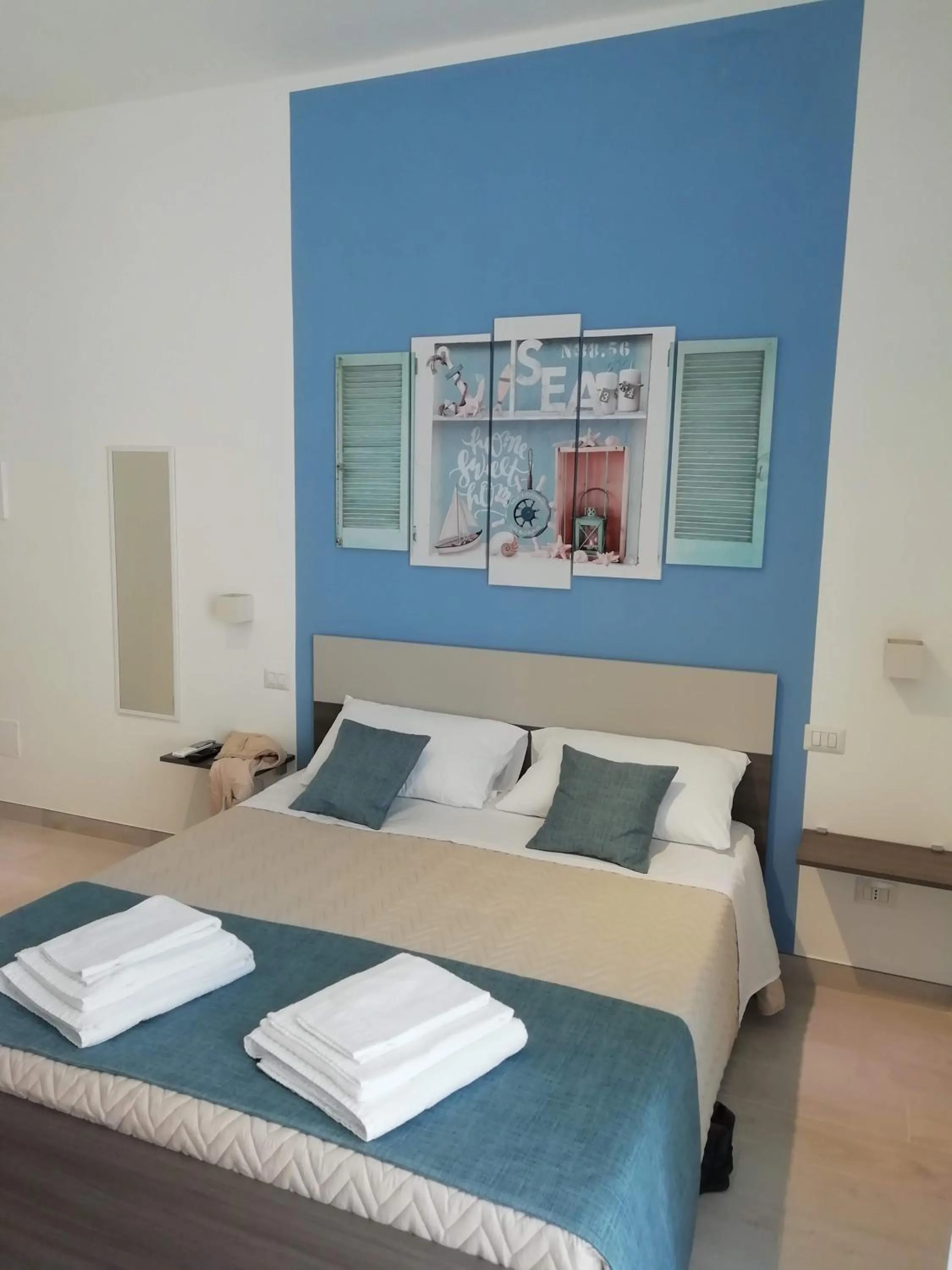 Bed in Flamingo Rooms