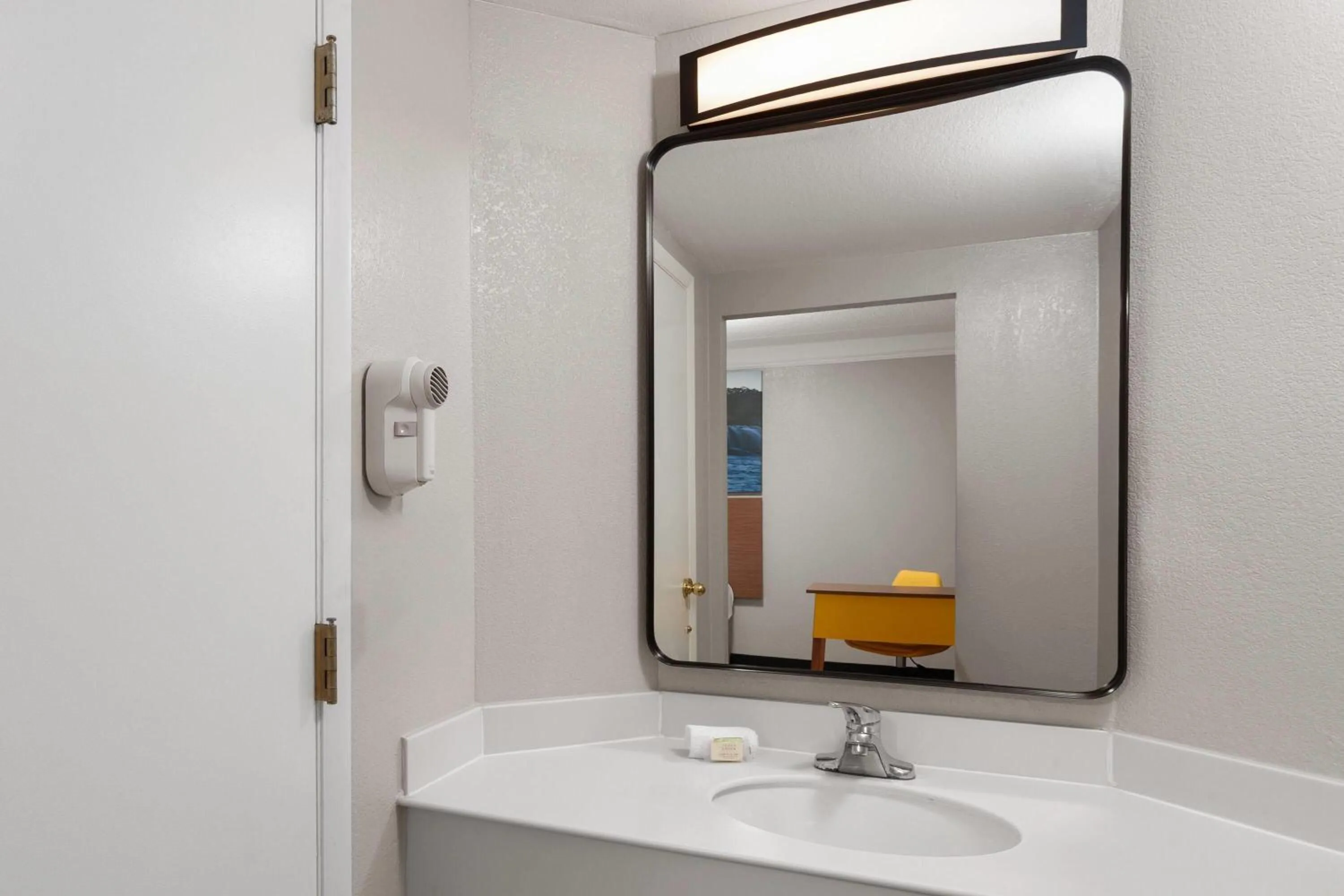 Bathroom in Days Inn & Suites by Wyndham Arlington Heights