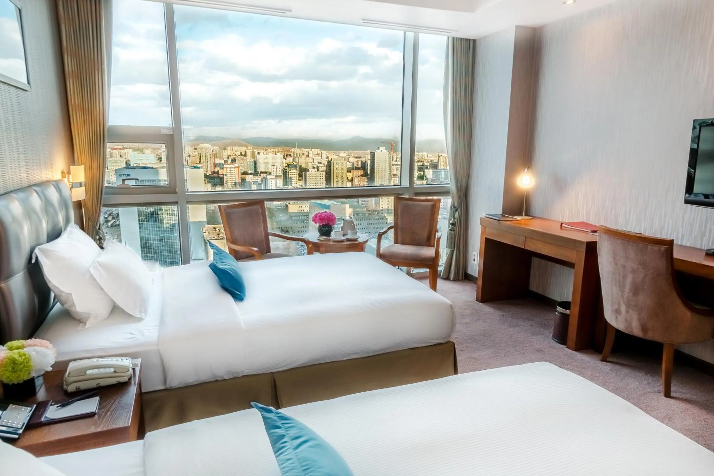 Bed in The Blue Sky Hotel and Tower