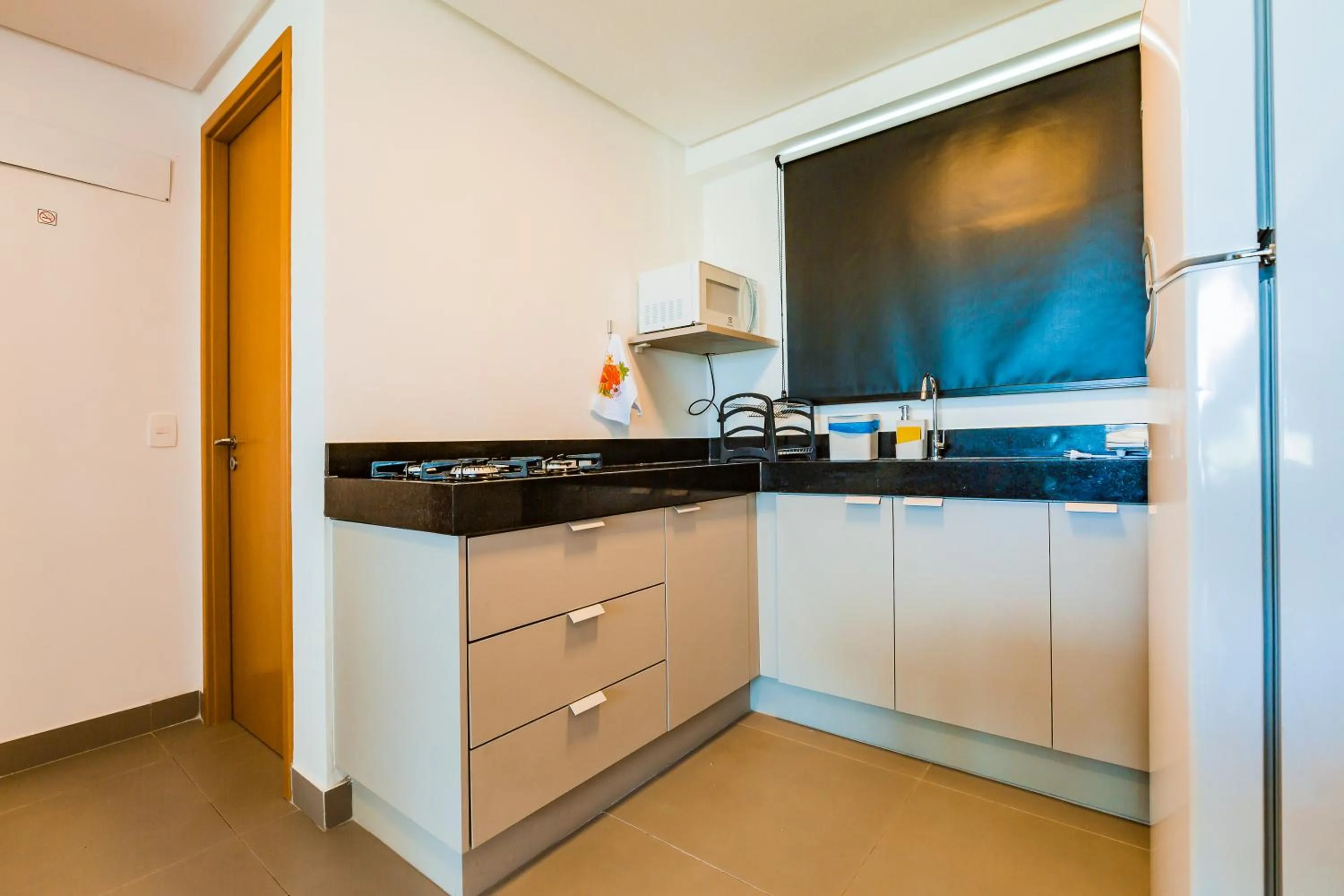 Kitchen or kitchenette in Macuco Residence