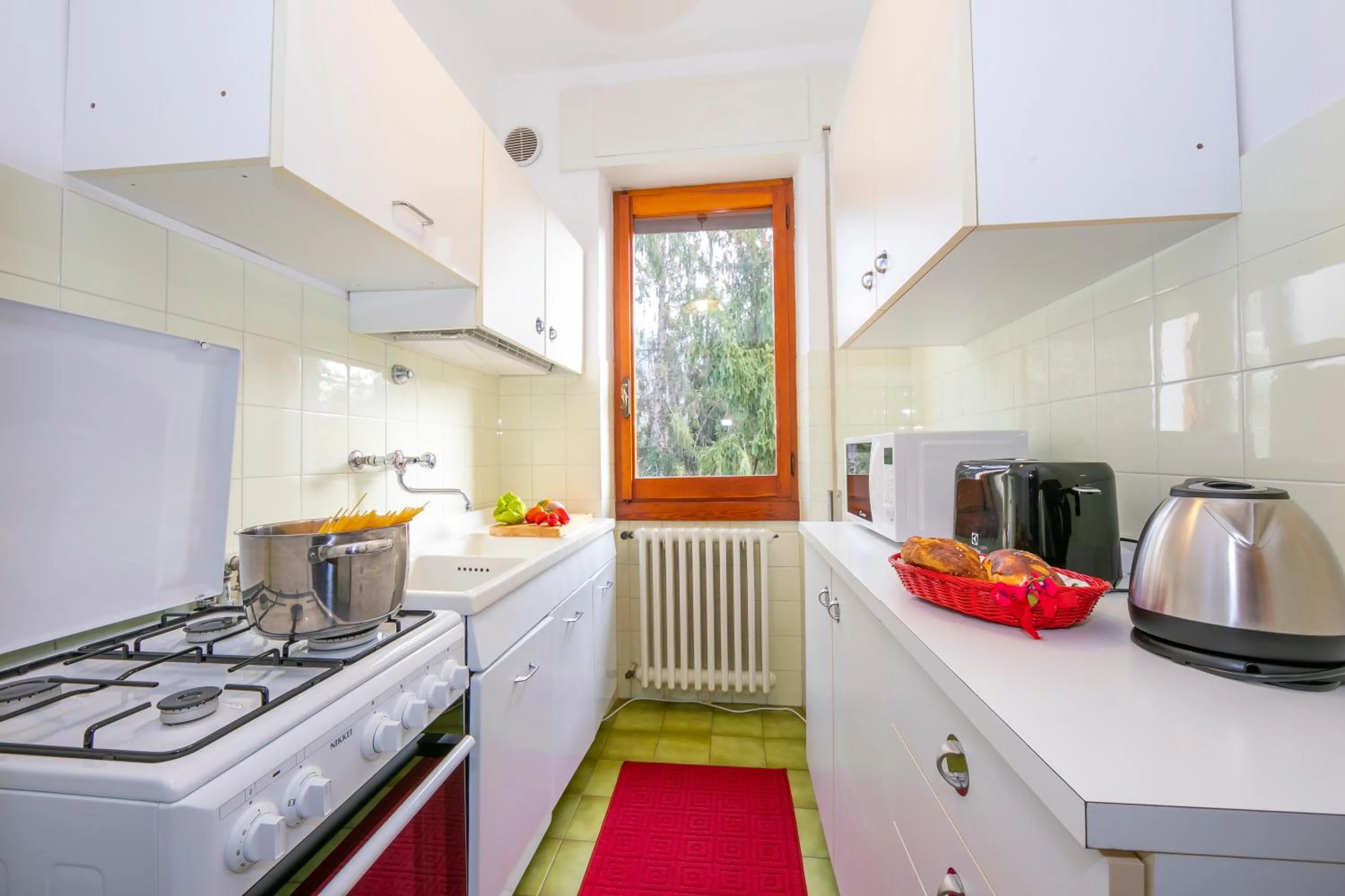 Kitchen or kitchenette in Villa La Verbanina Private Garden - Happy Rentals