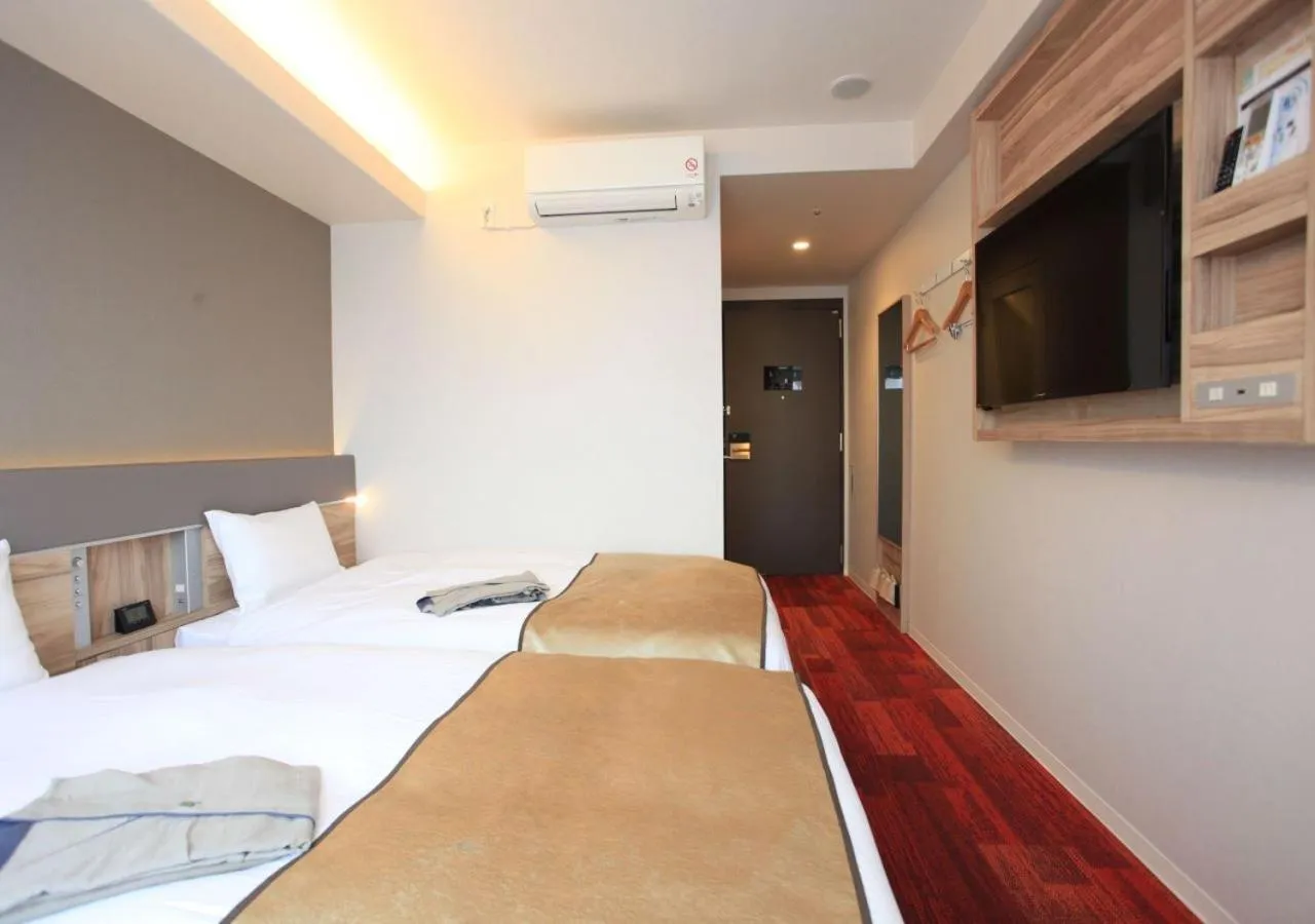 Bed in Urban Hotel Kyoto Gojo Premium