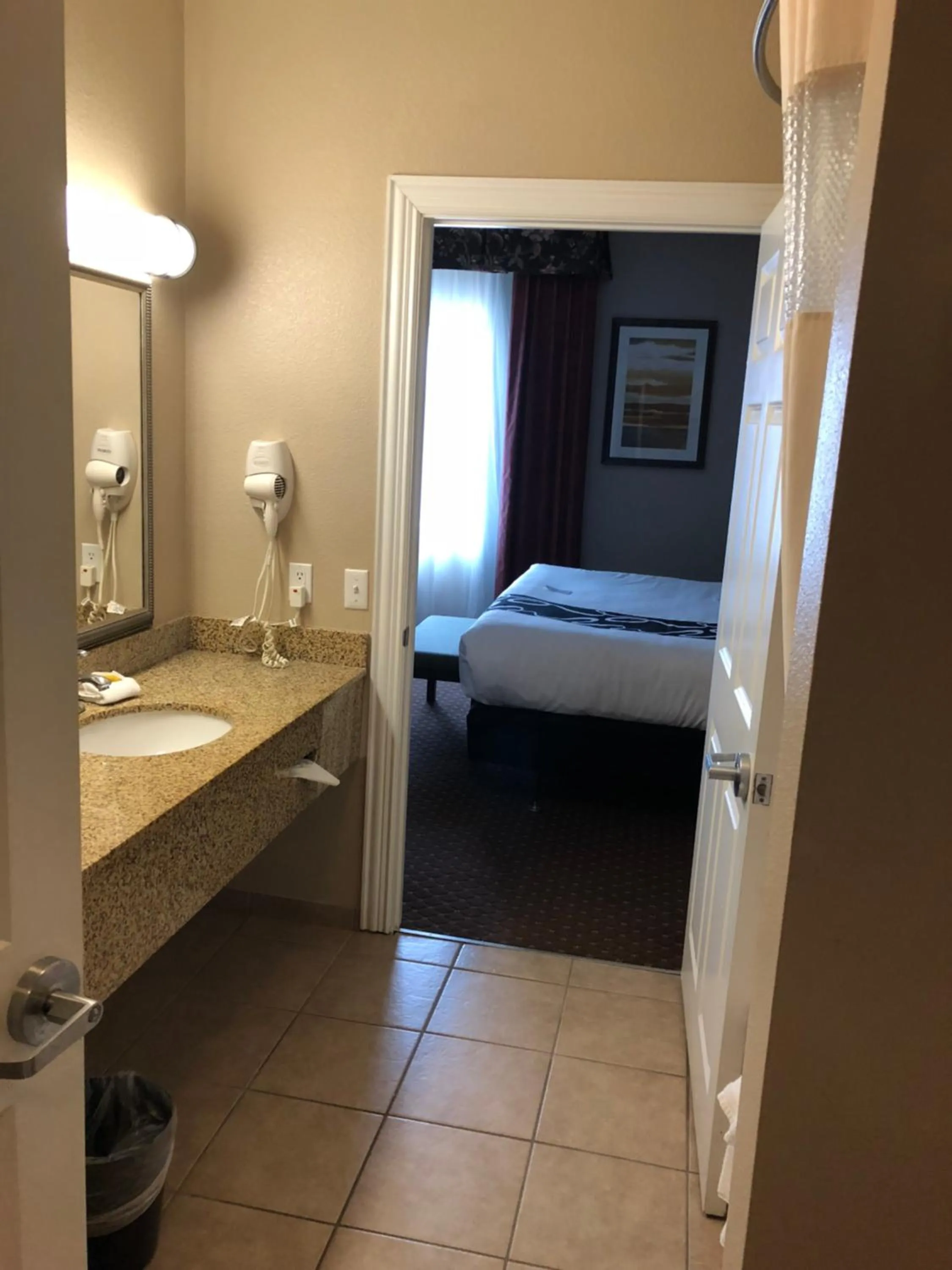 Bed in Americas Best Value Inn - Gun Barrel City