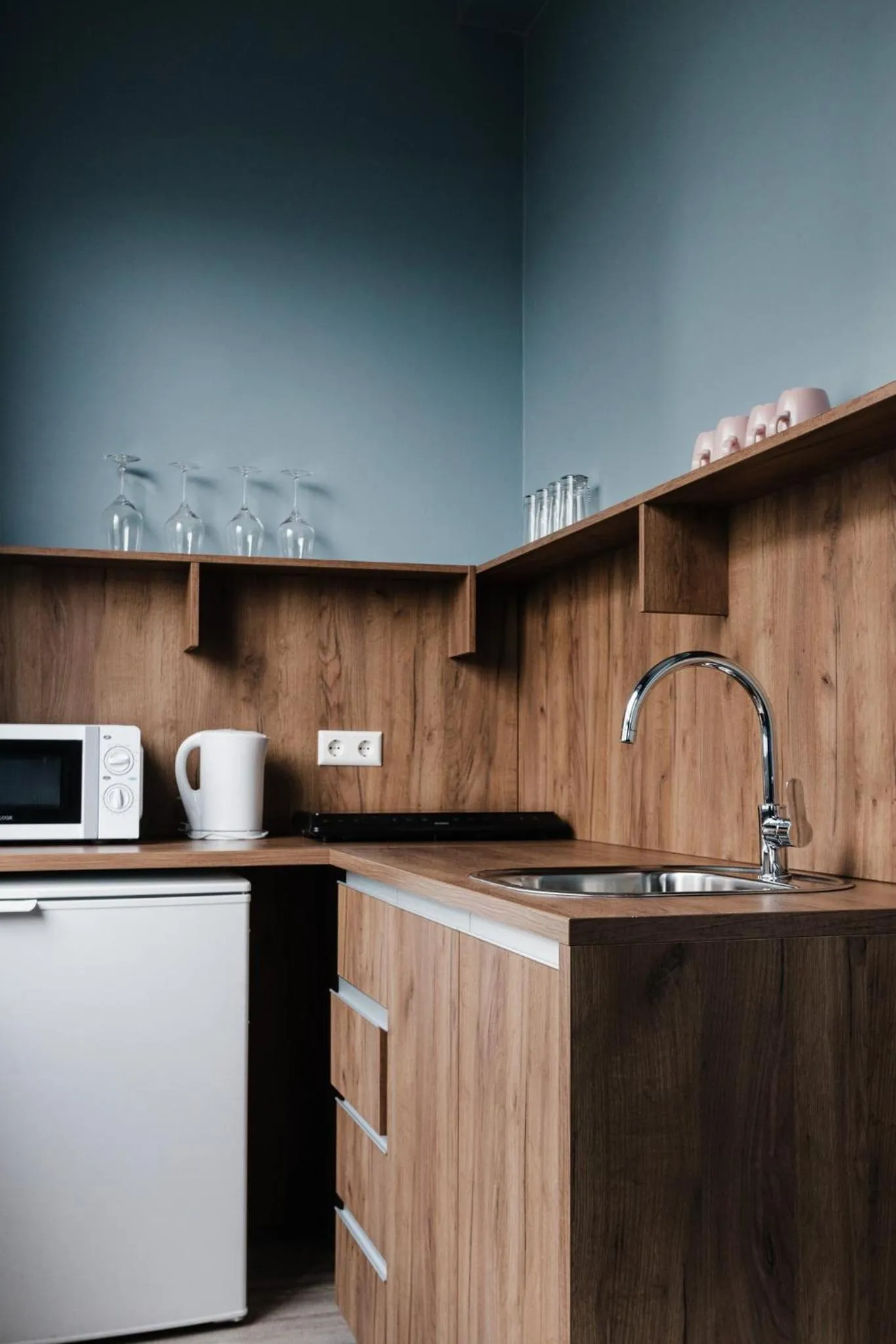 Kitchen or kitchenette in ODDSSON Midtown Hotel