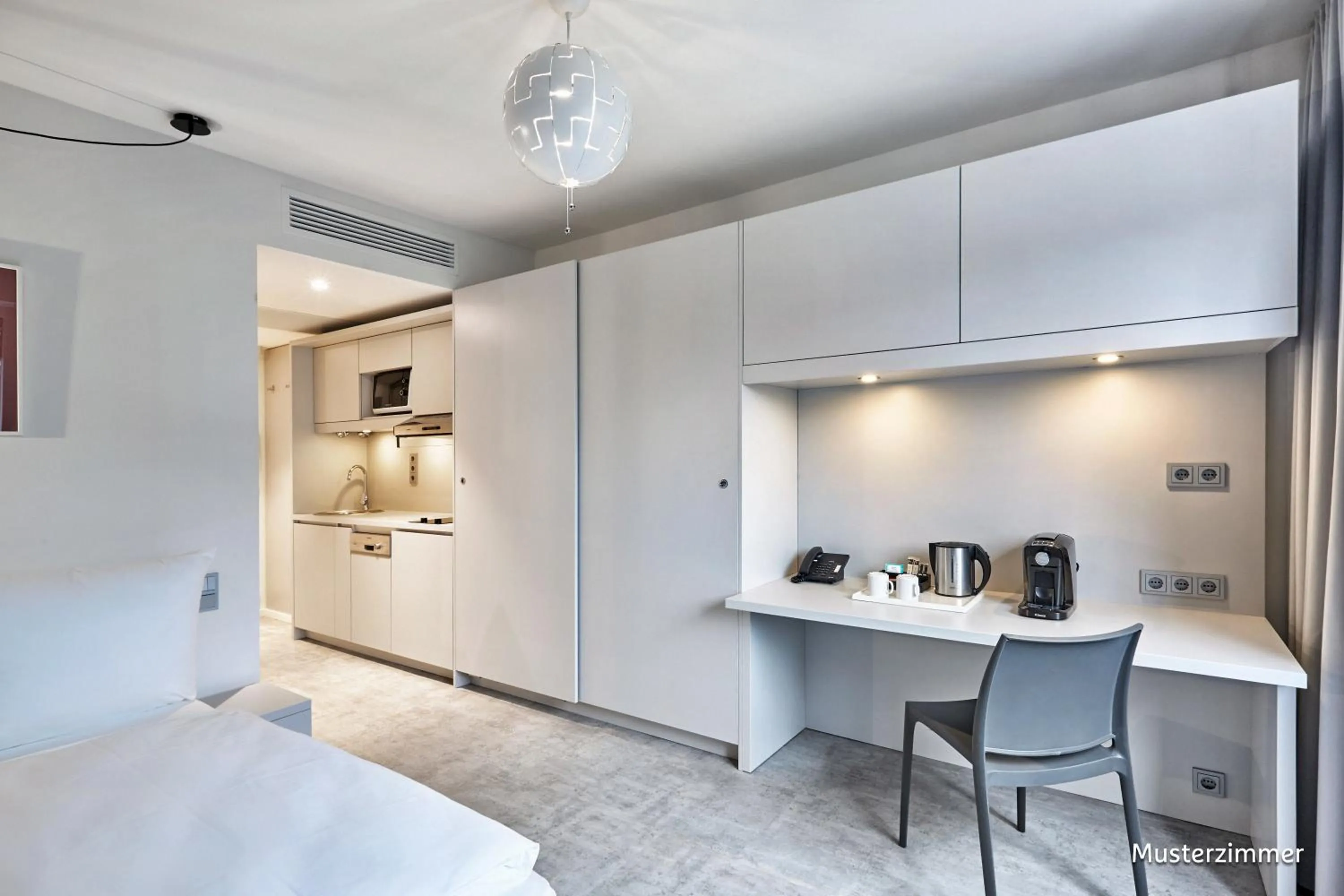 Kitchen or kitchenette, Bed in H.ome Serviced Apartments München