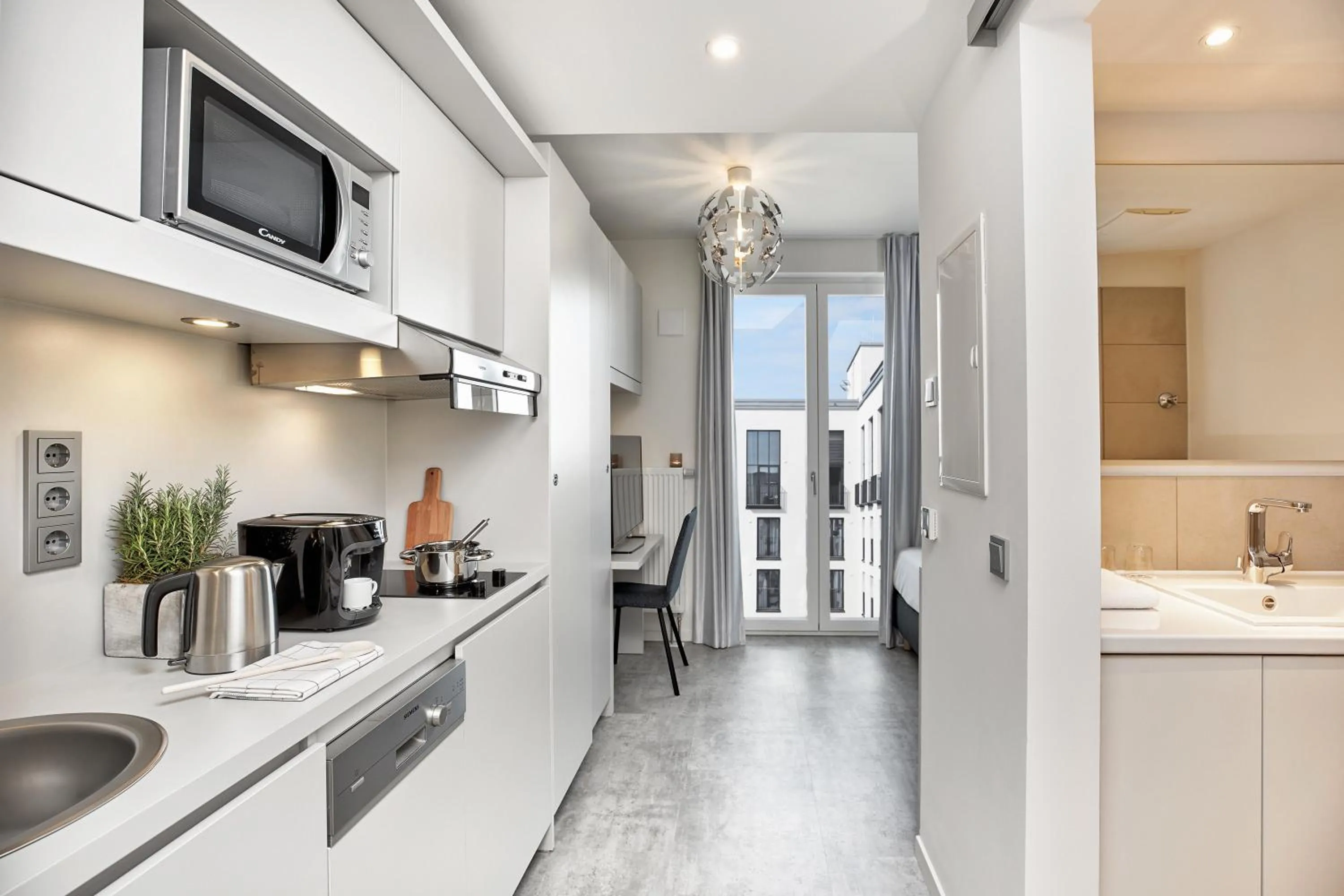 Kitchen or kitchenette in H.ome Serviced Apartments München