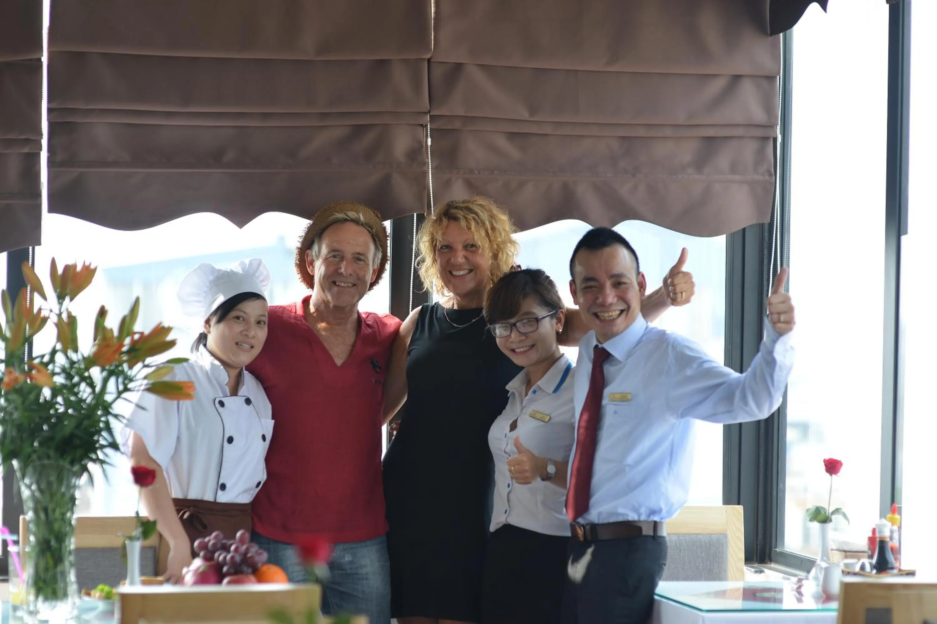 Staff in Blue Hanoi Inn Hotel