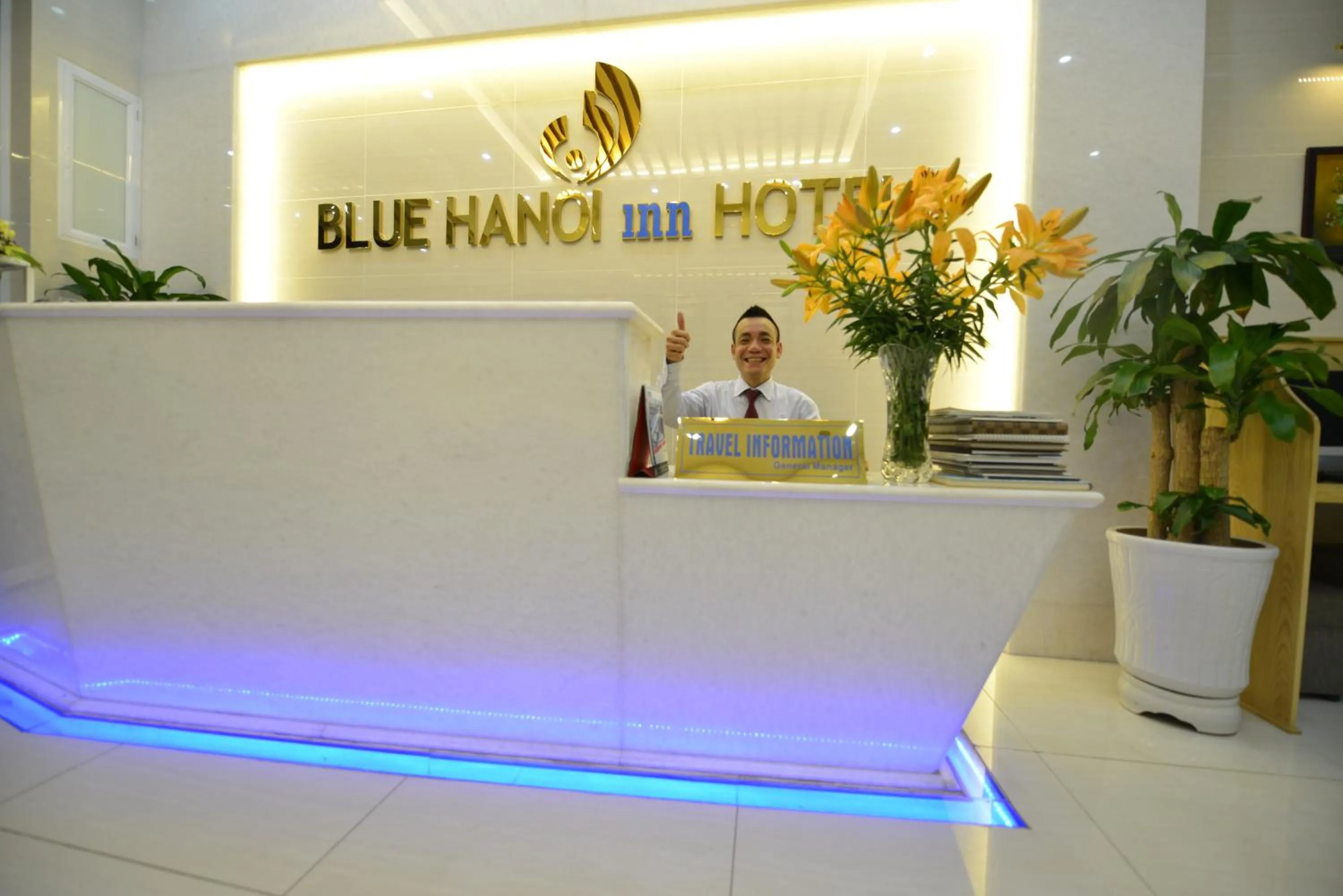Staff in Blue Hanoi Inn Hotel
