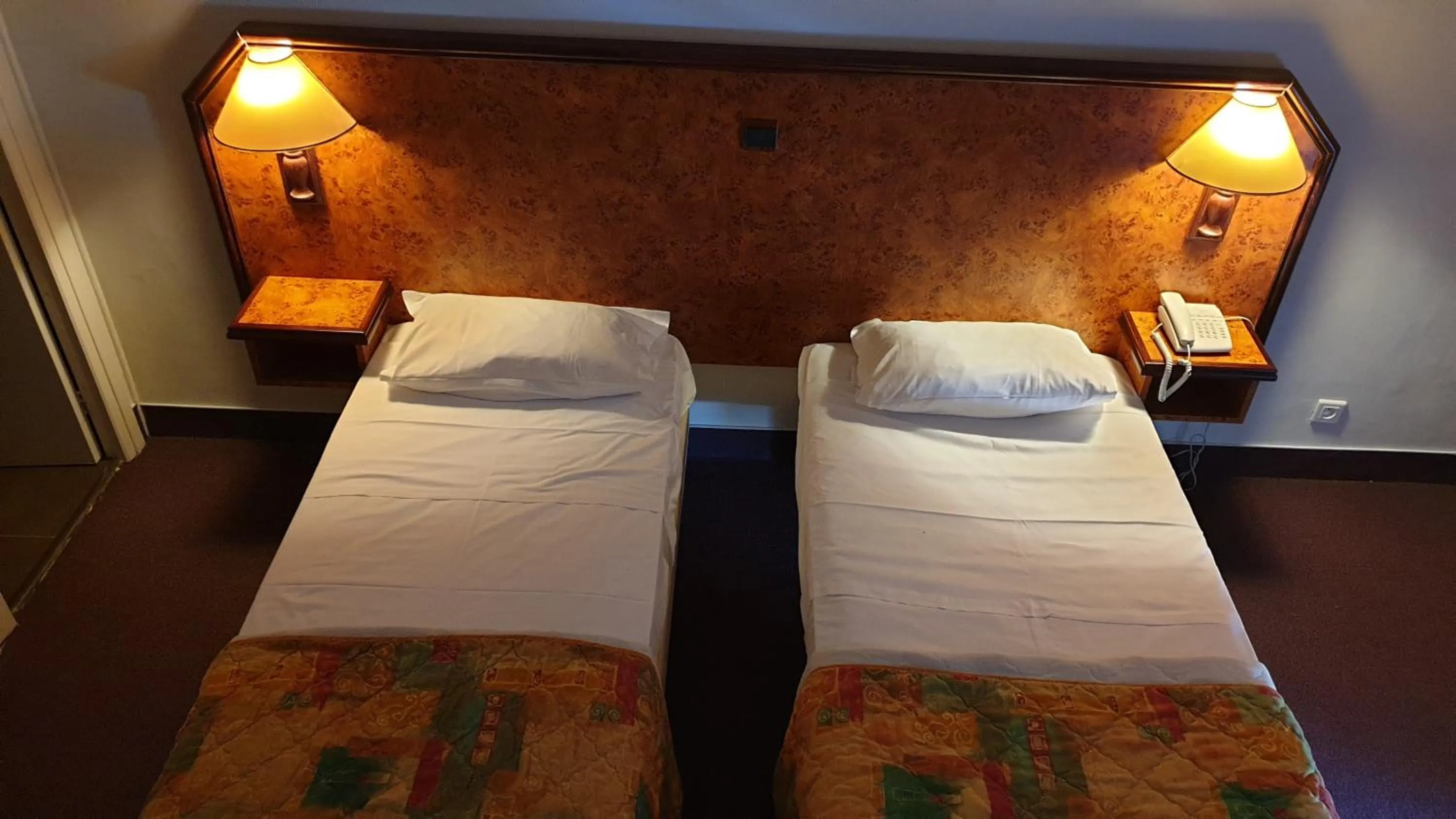 Bed in Hotel Madame Mere