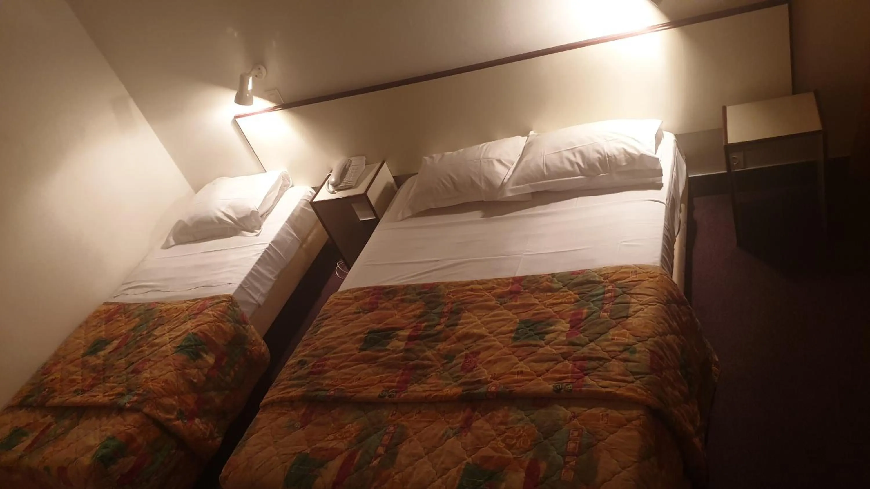 Bed in Hotel Madame Mere