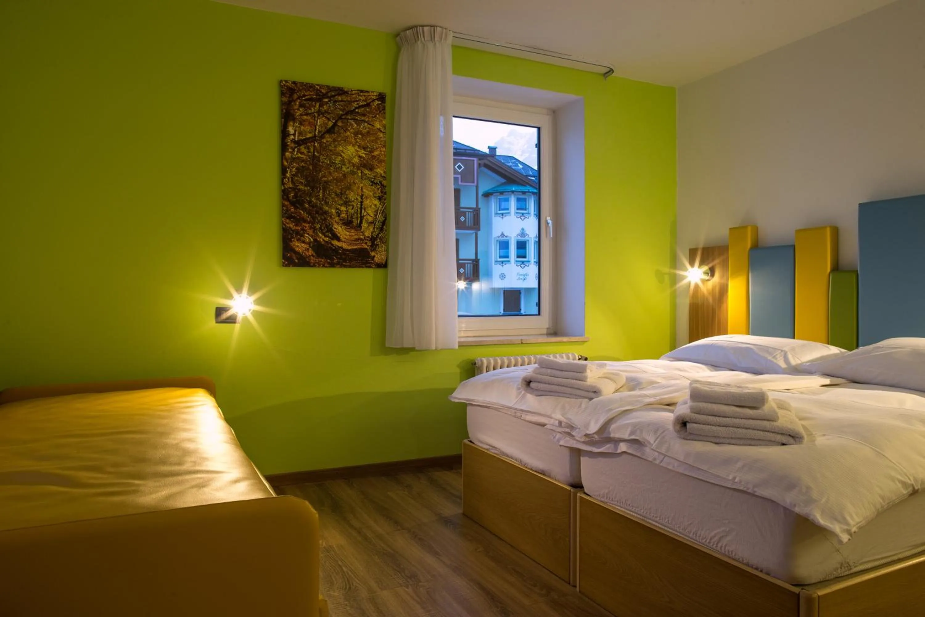 Bed in Alpencolor Hotel Tonale