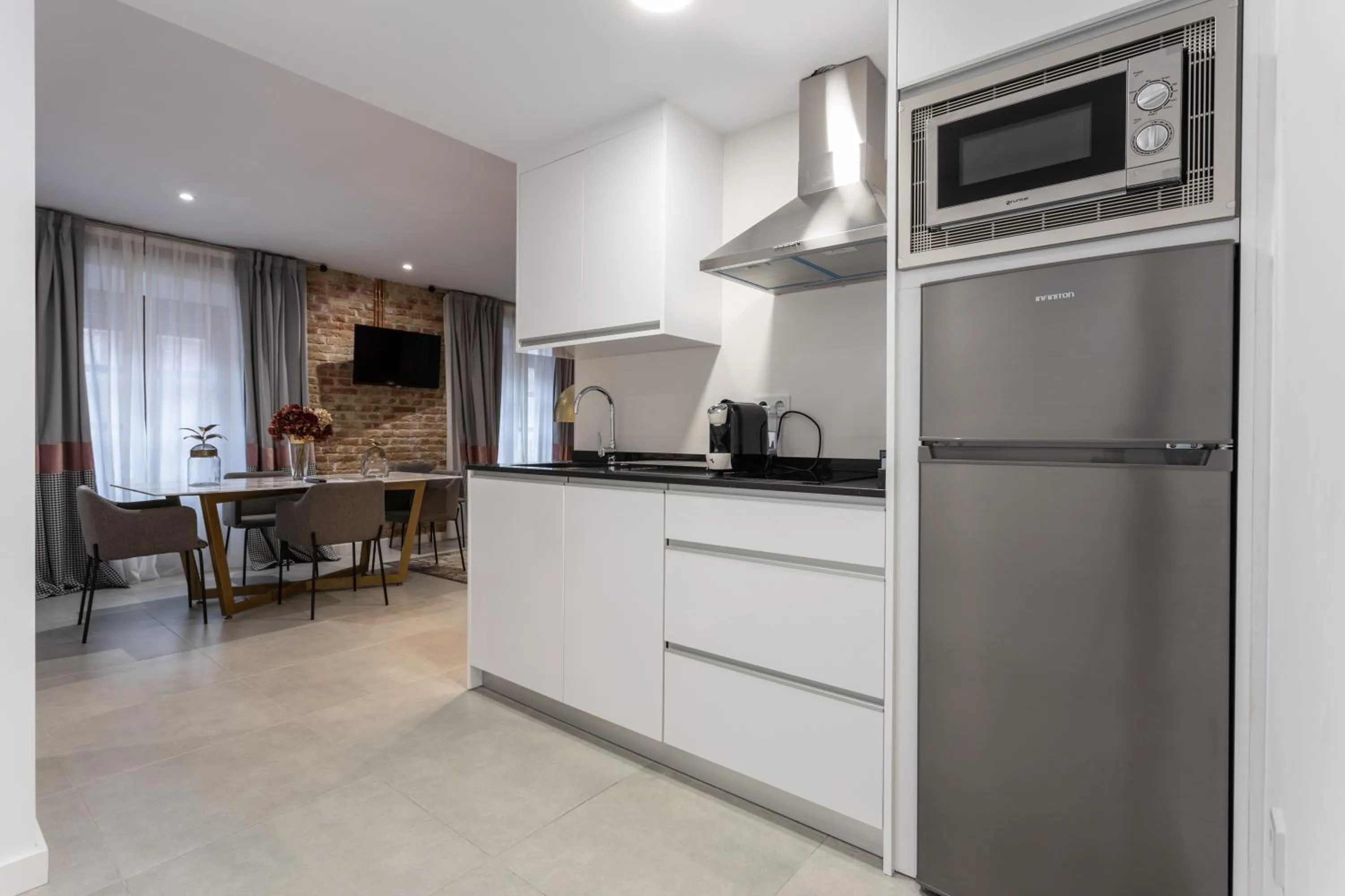 Kitchen or kitchenette in BiBo Suites Plaza Nueva