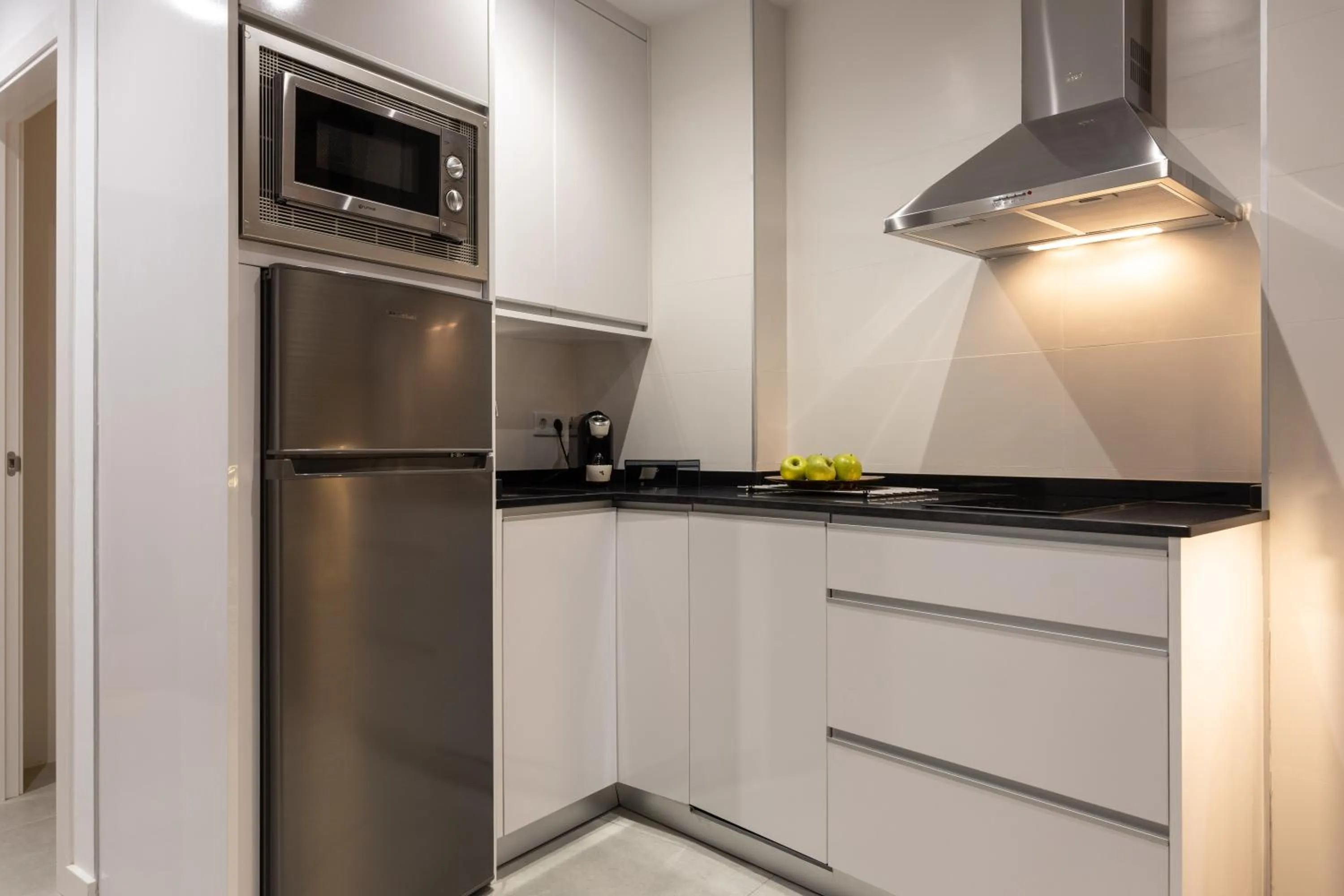 Kitchen or kitchenette in BiBo Suites Plaza Nueva