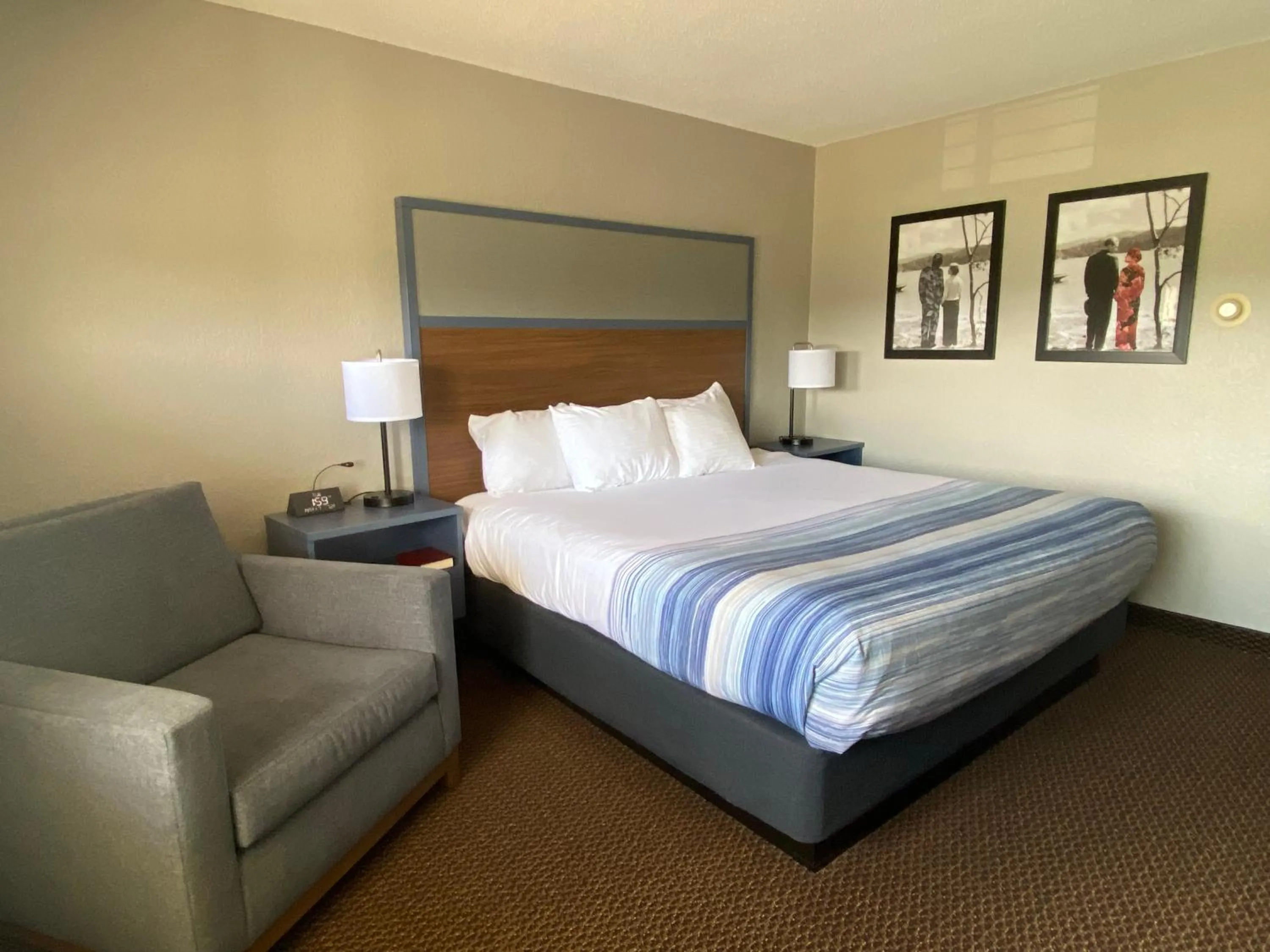 Bed in AmericInn by Wyndham New Richmond