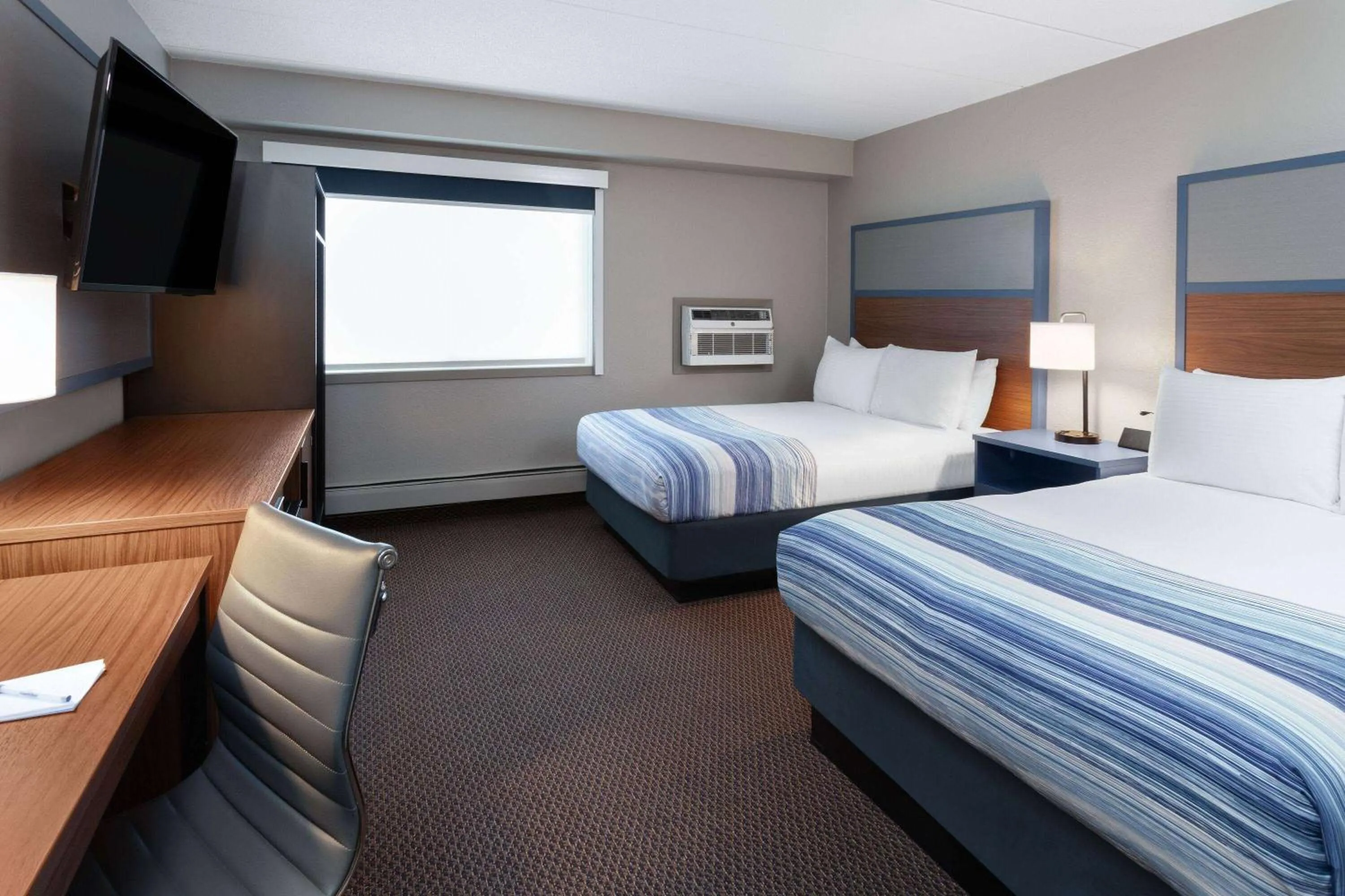 Photo of the whole room, Bed in AmericInn by Wyndham New Richmond