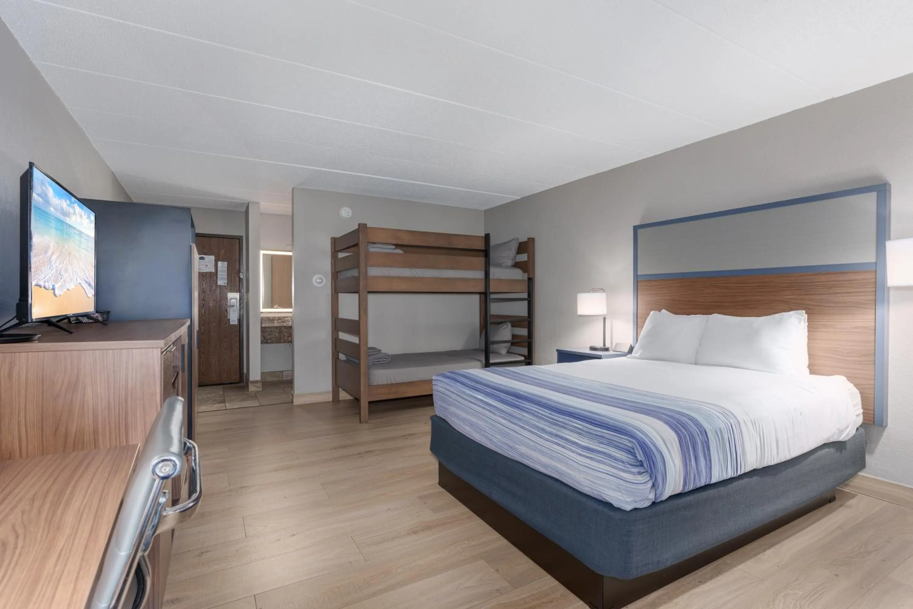 Bed in AmericInn by Wyndham New Richmond