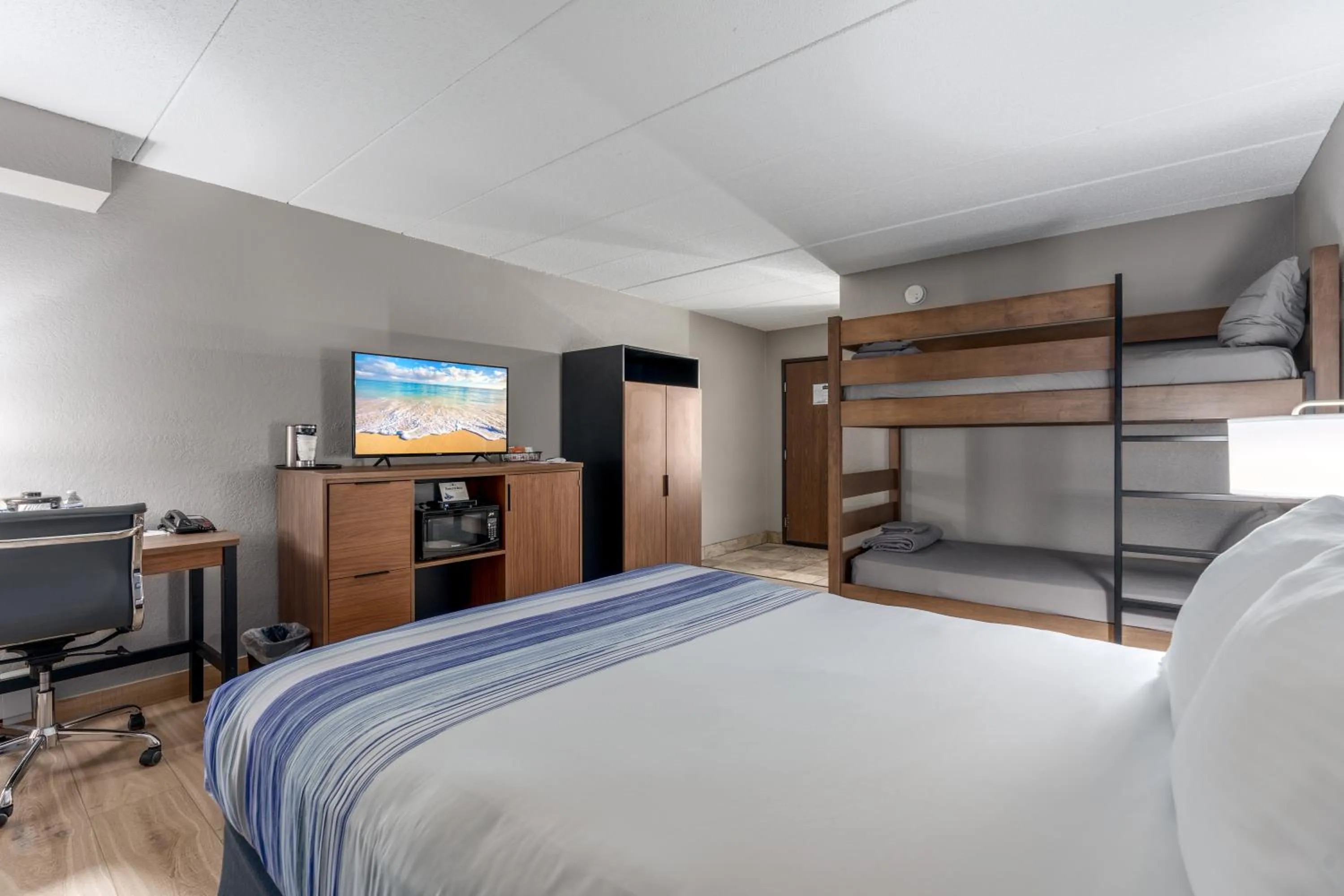 Bed in AmericInn by Wyndham New Richmond