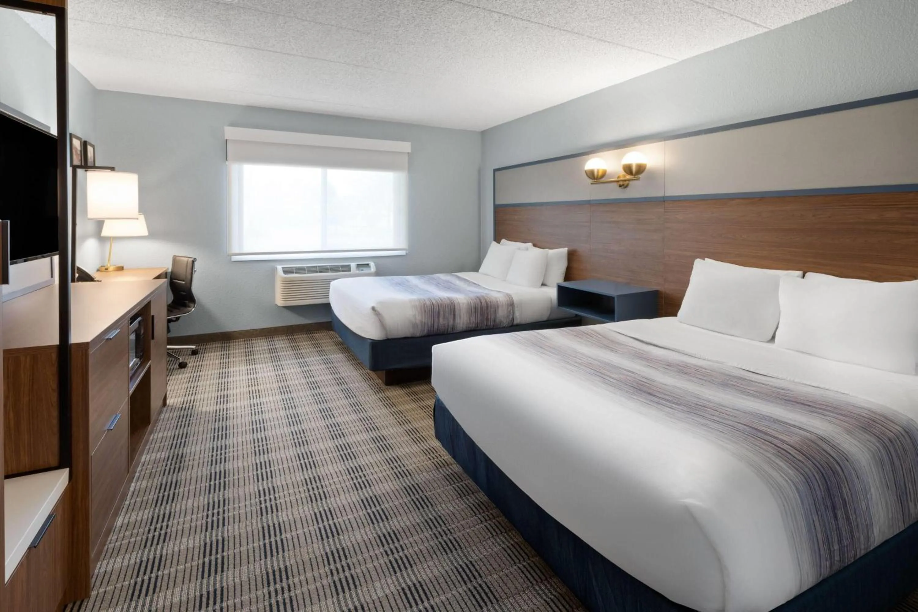 Photo of the whole room, Bed in AmericInn by Wyndham Chippewa Falls