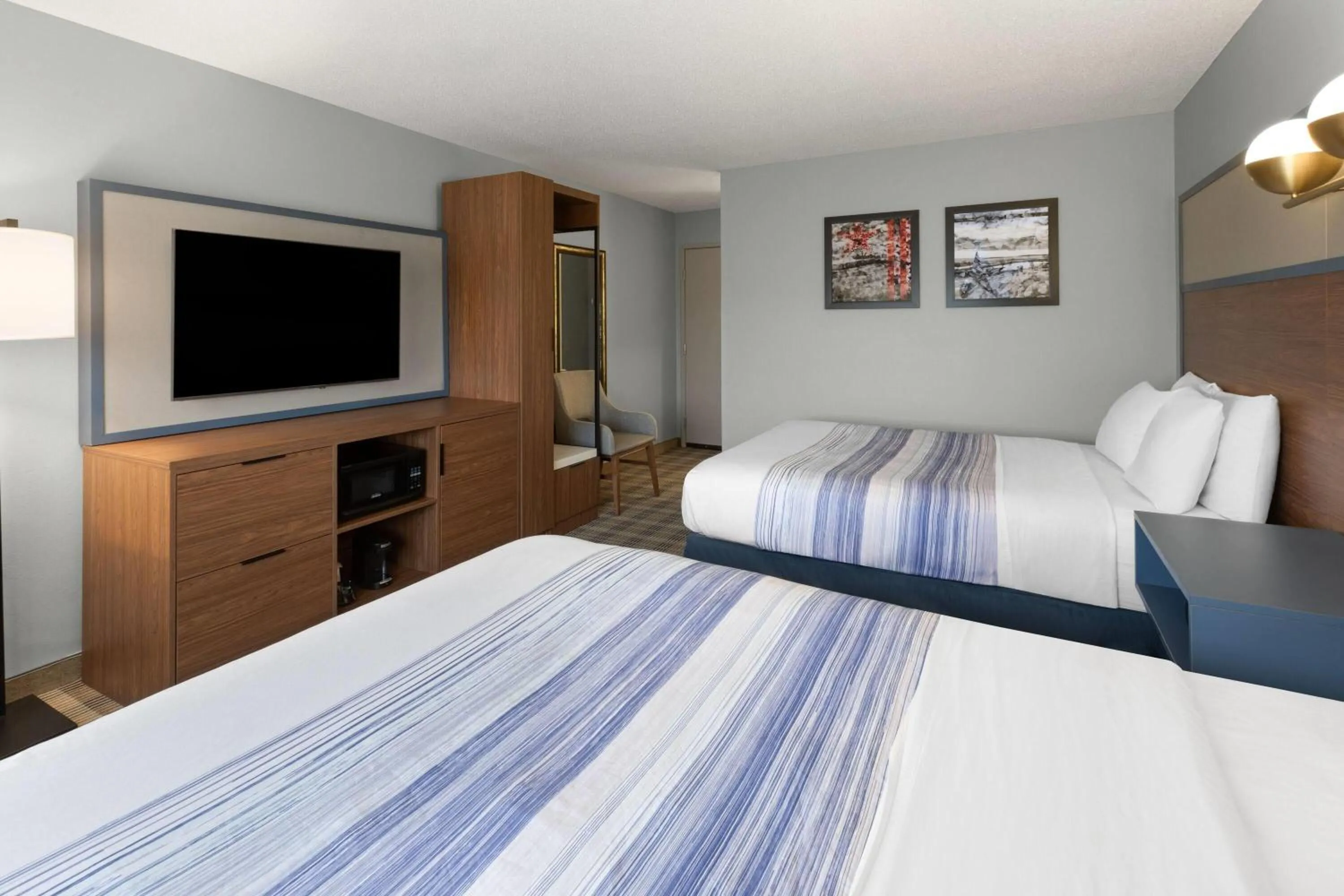 Photo of the whole room, Bed in AmericInn by Wyndham Chippewa Falls