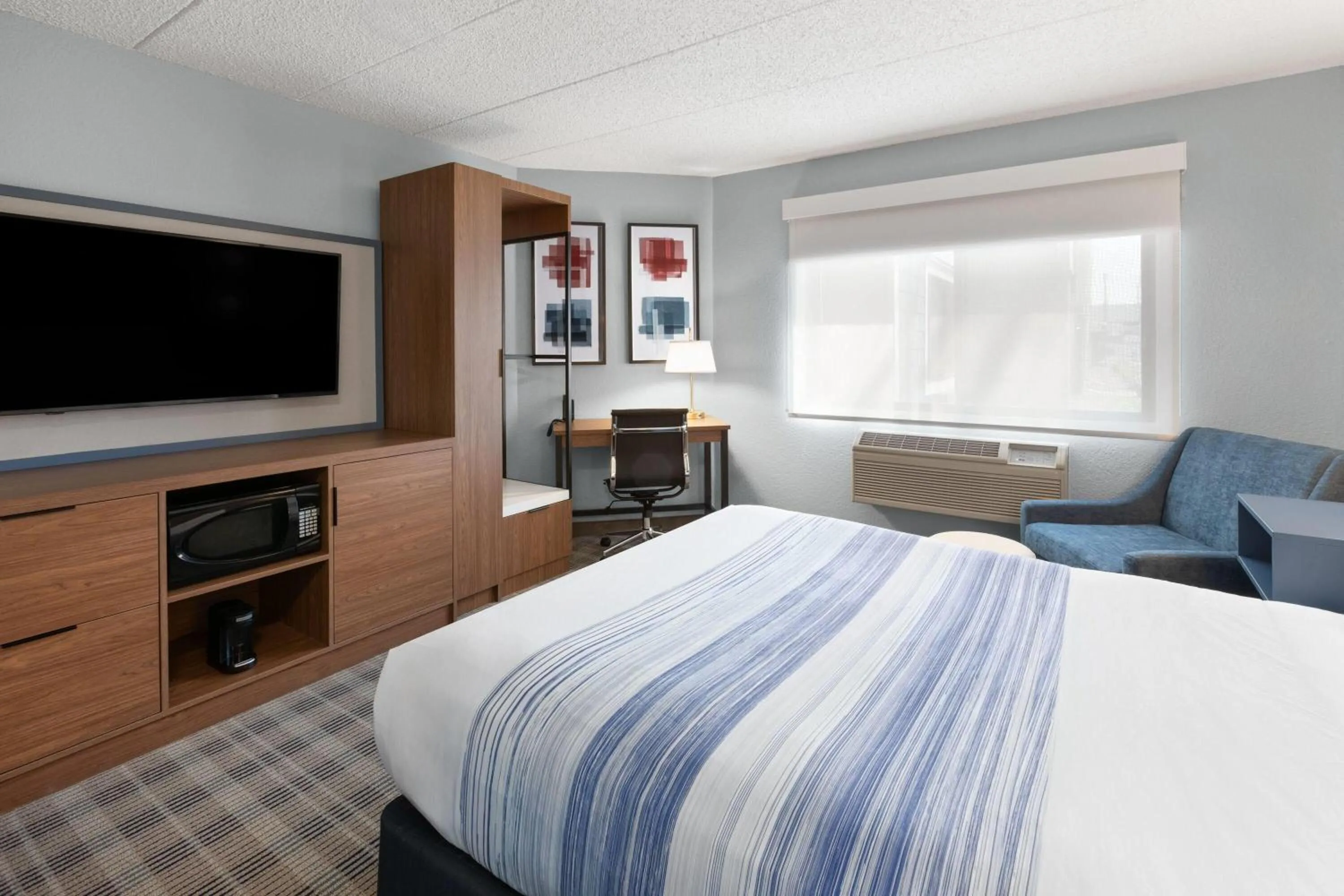 Photo of the whole room, Bed in AmericInn by Wyndham Chippewa Falls