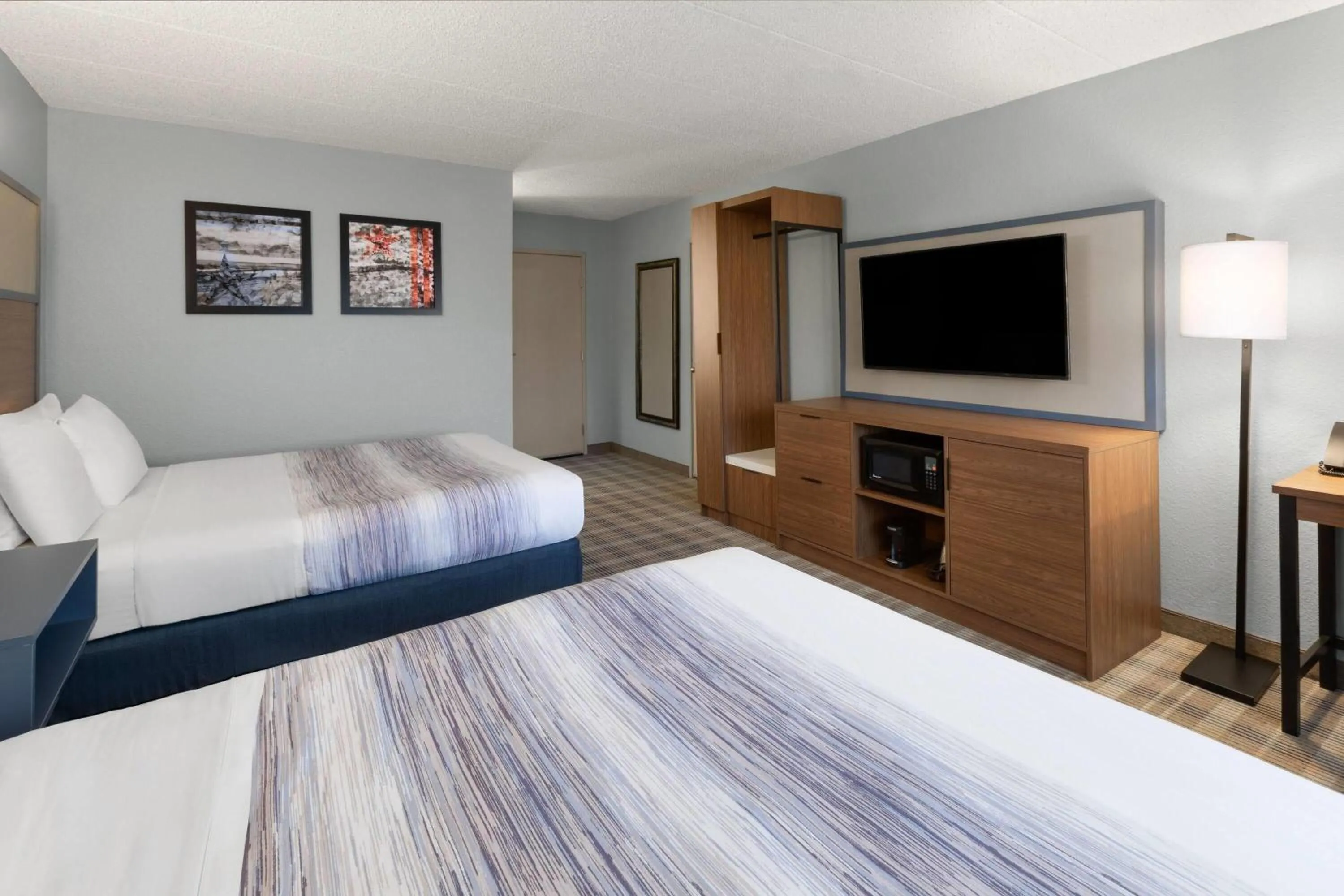 Photo of the whole room, Bed in AmericInn by Wyndham Chippewa Falls