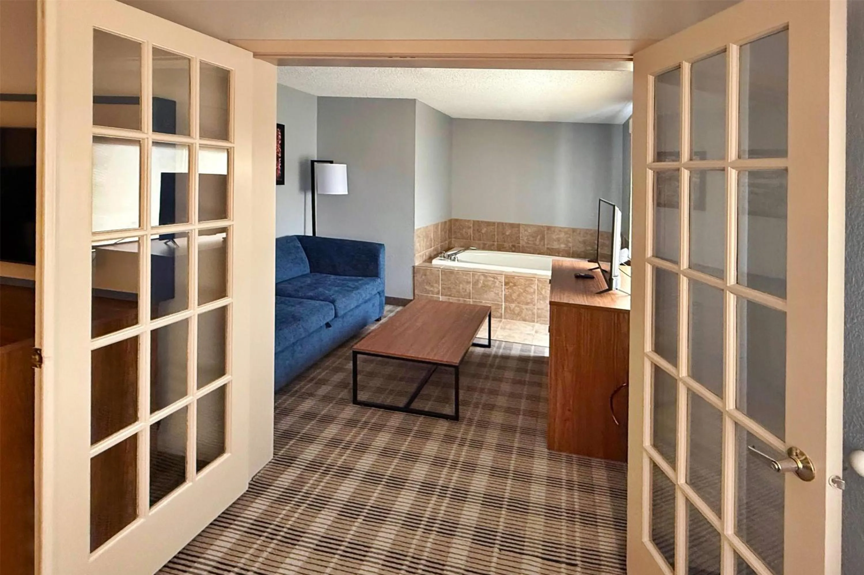 Photo of the whole room, Bed in AmericInn by Wyndham Chippewa Falls
