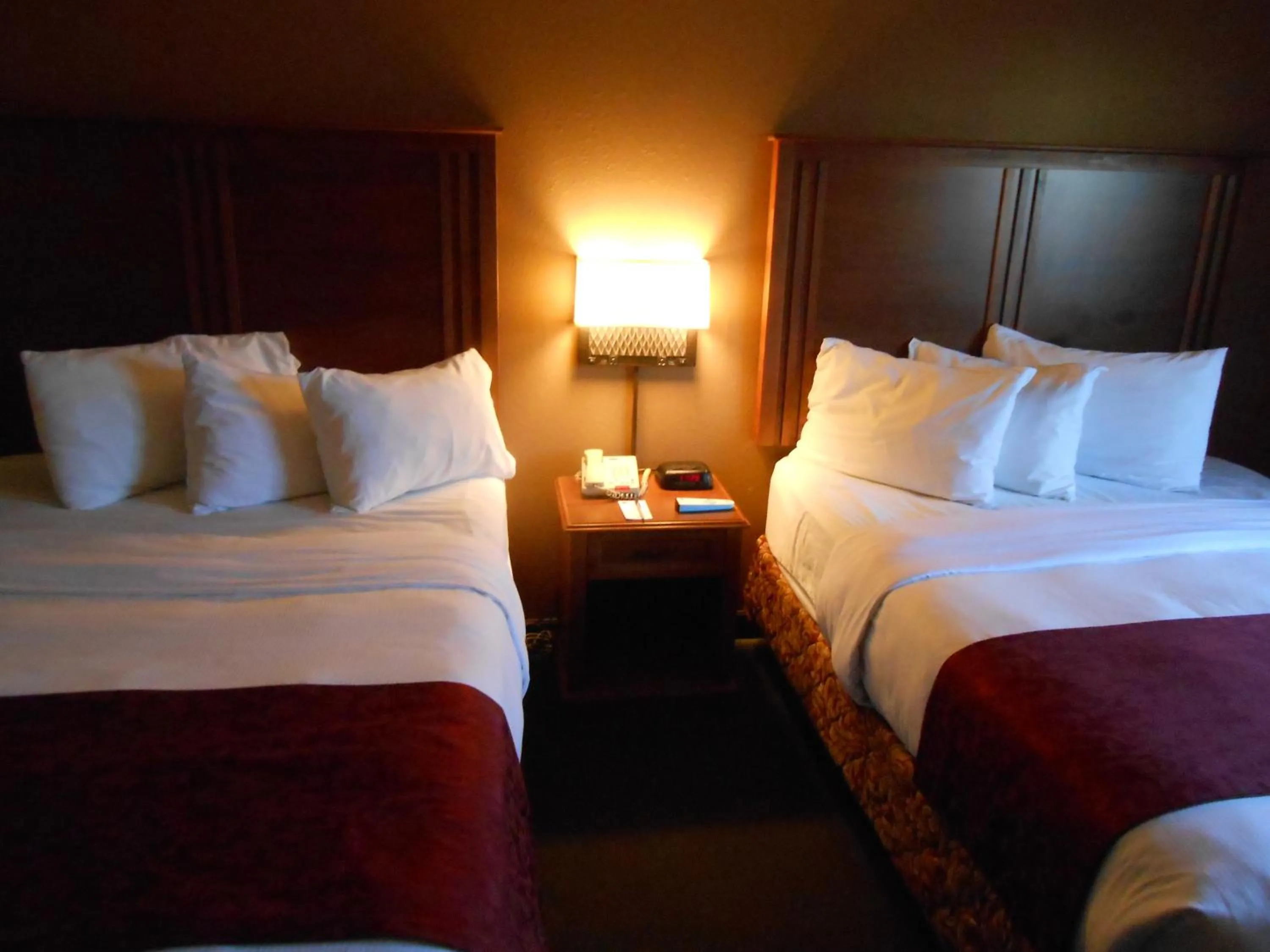 Bed in AmericInn by Wyndham McAlester