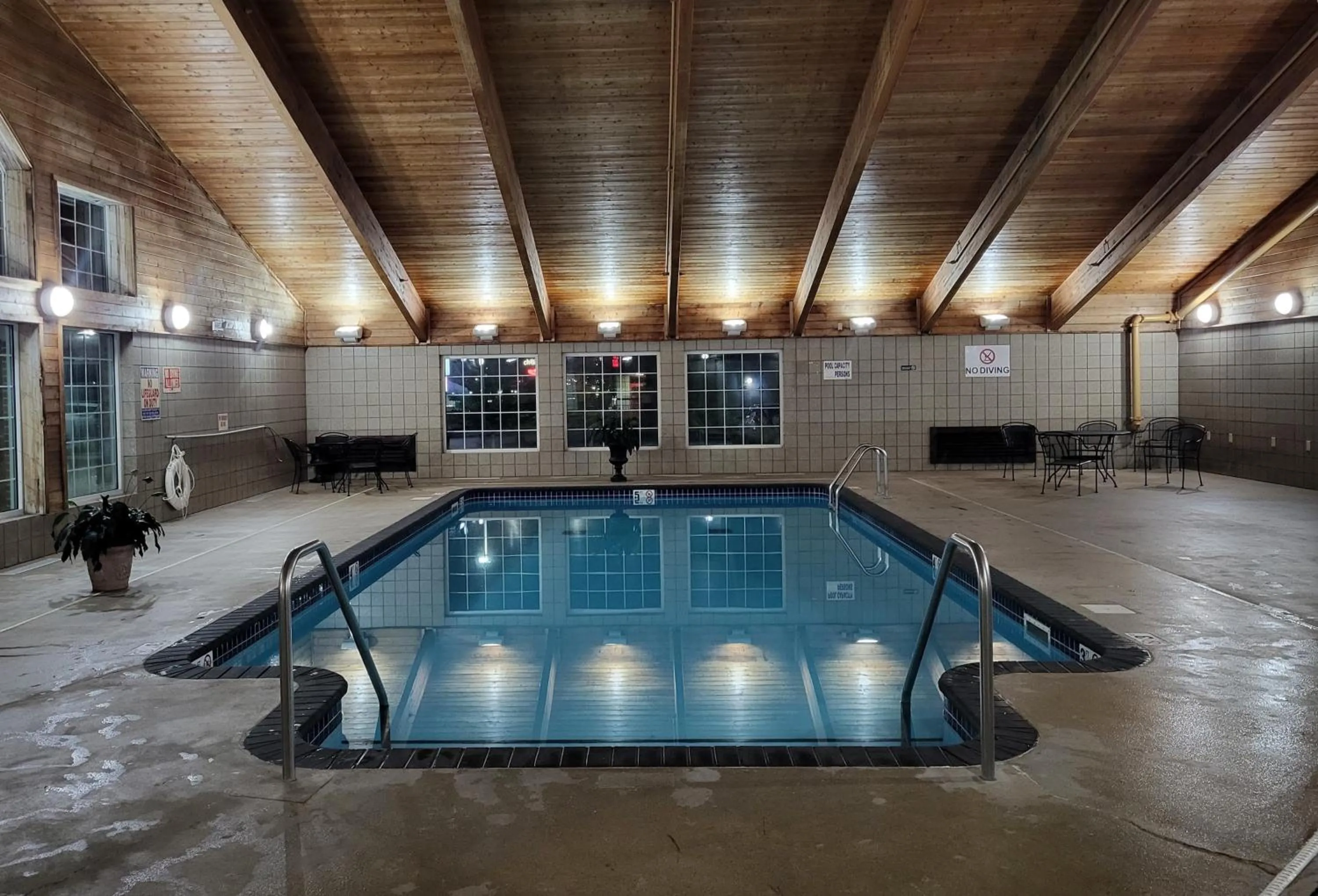 Swimming pool in AmericInn by Wyndham McAlester