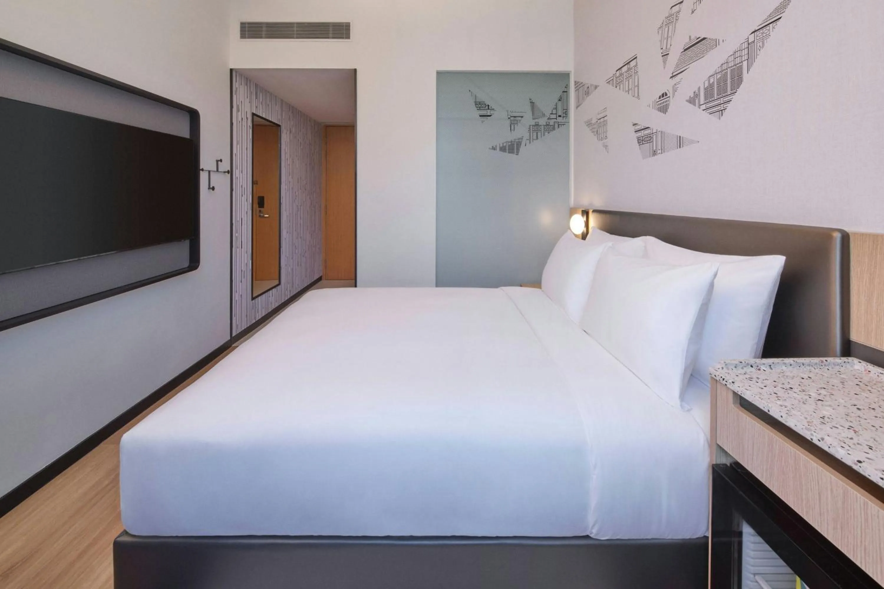 Photo of the whole room, Bed in Aloft Singapore Novena