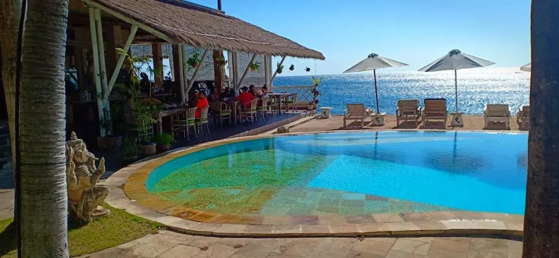 Pool view in Tauch Terminal Resort Tulamben & Spa Pool view in Tauch Terminal Resort Tulamben & Spa