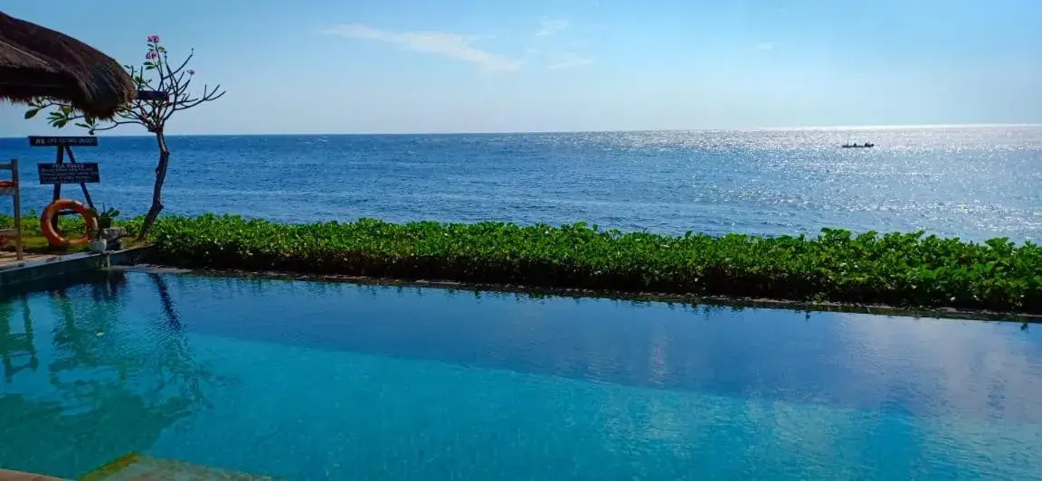 Pool view in Tauch Terminal Resort Tulamben & Spa Pool view in Tauch Terminal Resort Tulamben & Spa
