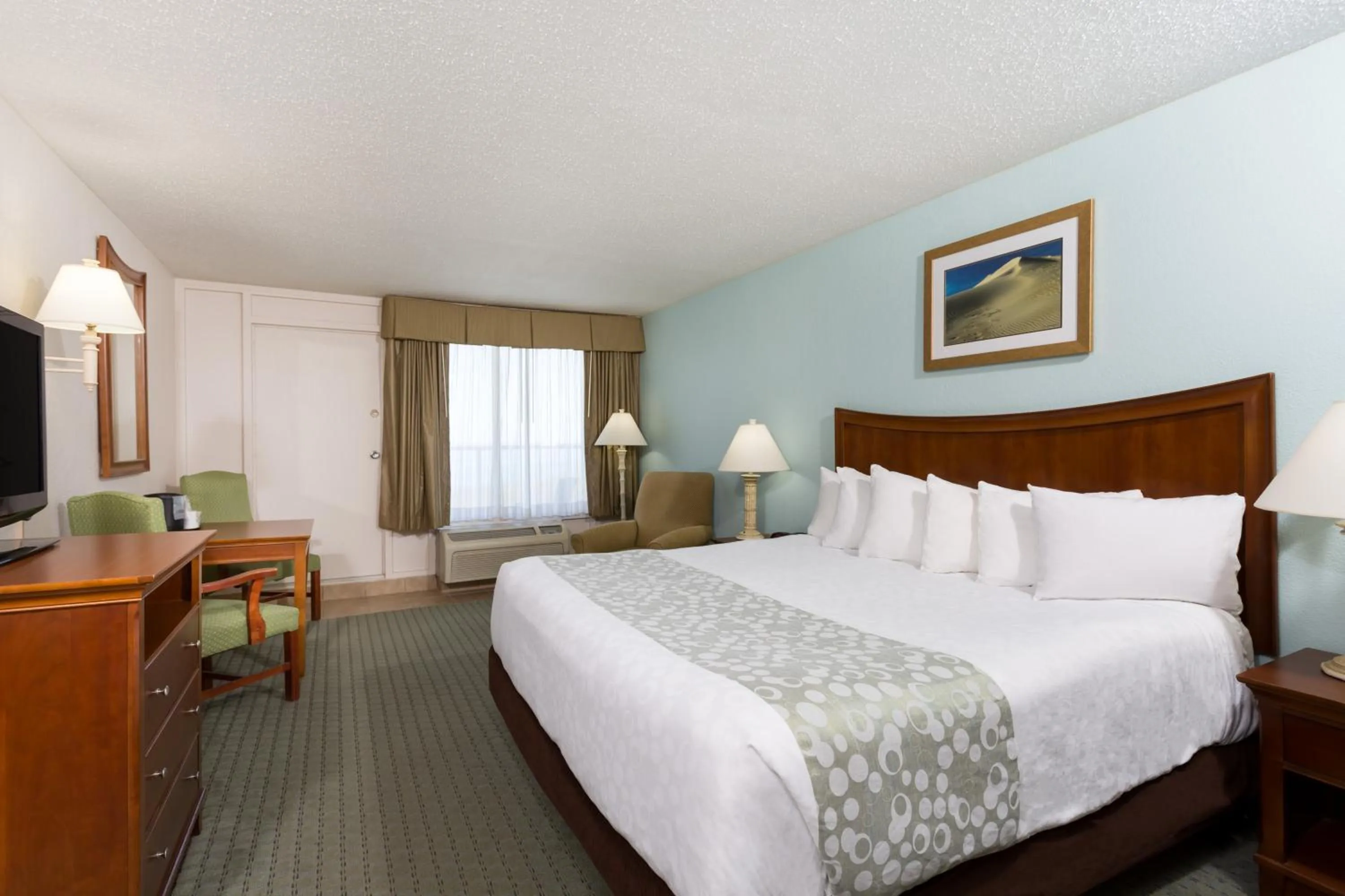 Bed in Ramada Plaza by Wyndham Nags Head Oceanfront